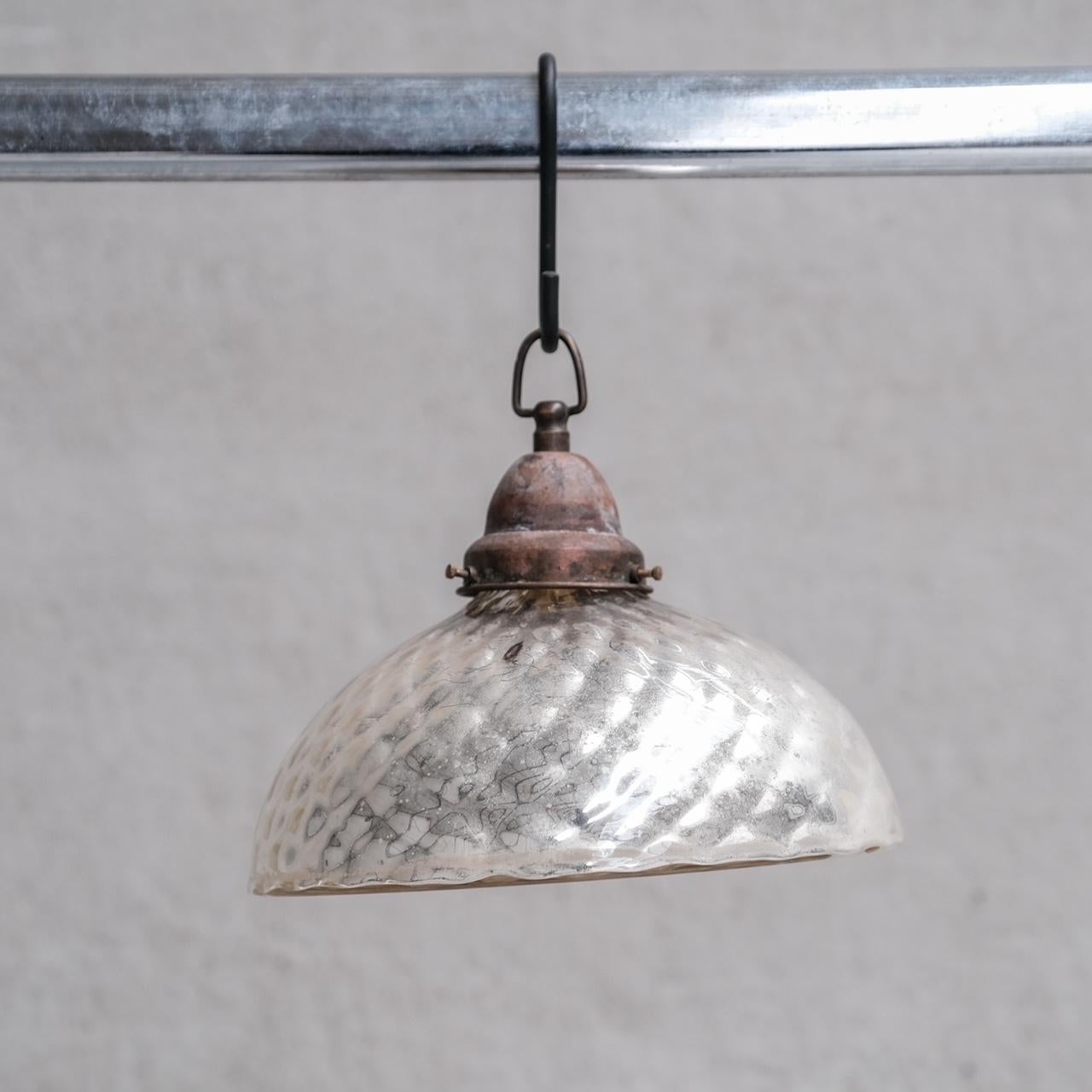 A double walled antique mercury glass pendant light.

France, c1930s.

Lovely patination commensurate with age.

Since re-wired and PAT tested.

Internal ref: 27/12/23/017.

Good vintage condition, some scuffs and wear commensurate with