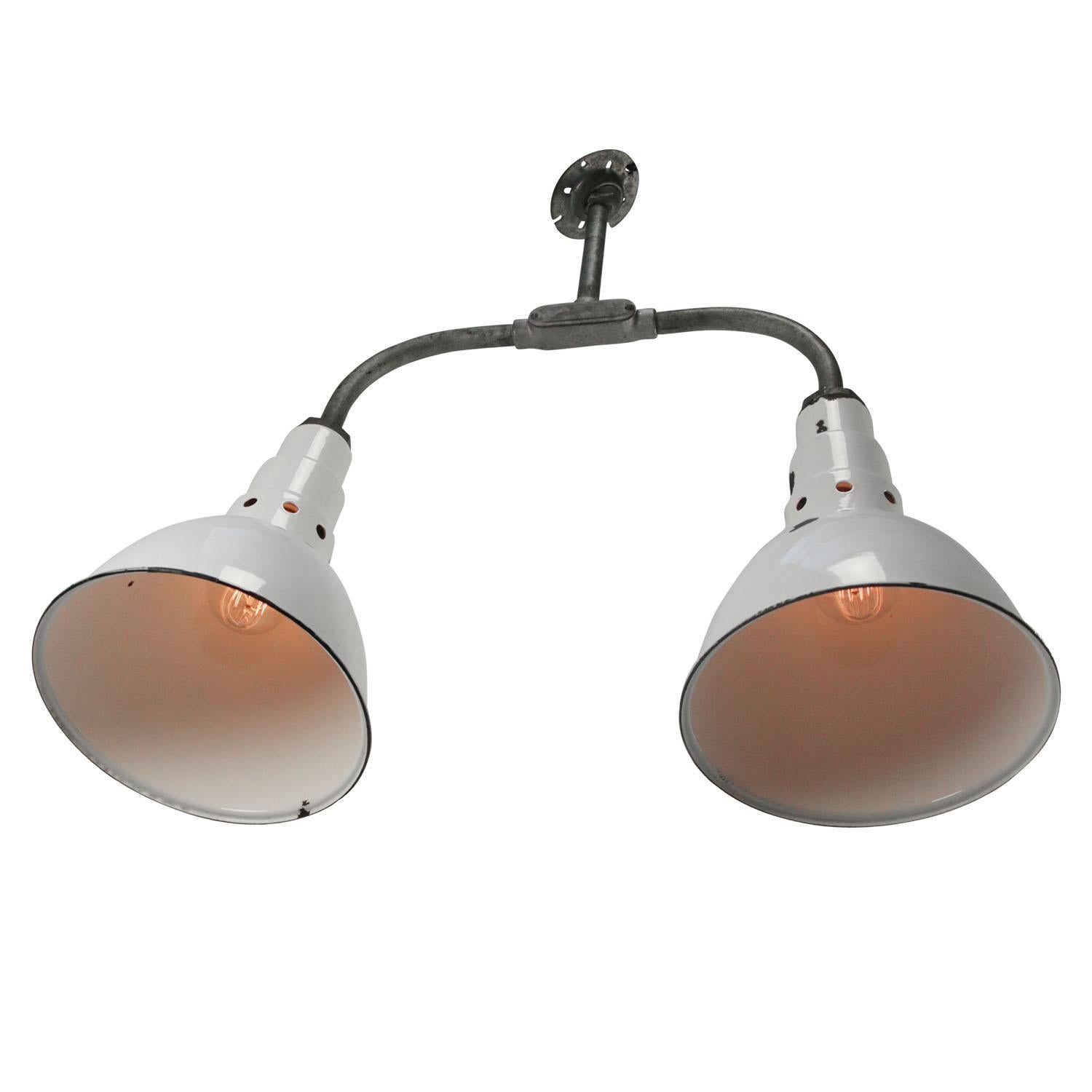 Double Factory American hanging lights. White enamel. White interior.
Cast iron frame with 2 white enamel shades

Weight 4.00 kg / 8.8 lb

Priced per individual item. All lamps have been made suitable by international standards for incandescent