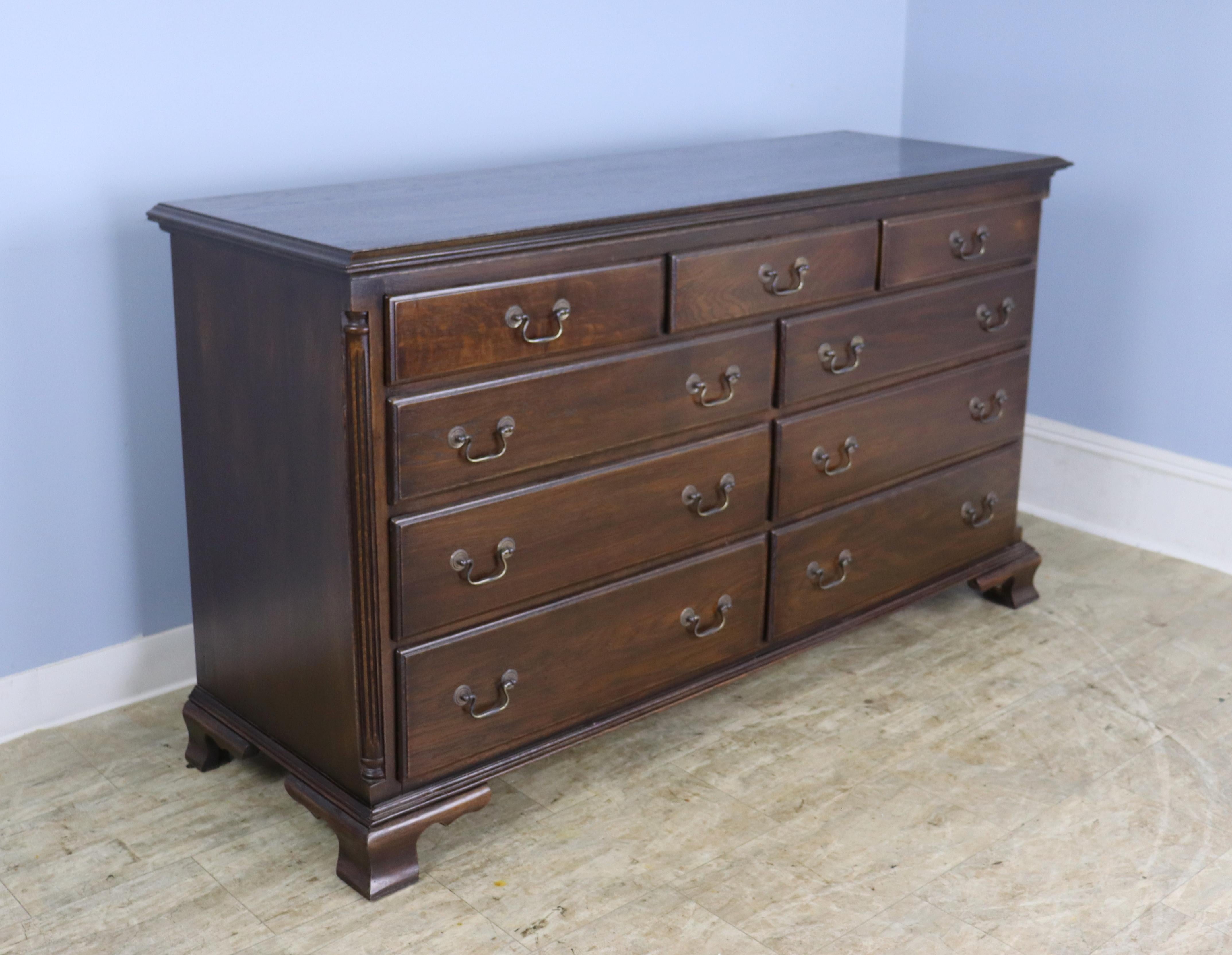 A classic 3 over 6 double width oak chest, custom made in England for Briggs House Antiques.  Beautiful traditional high quality workmanship but the cleanliness of a new piece.  Period-style details include mouldings around the top and bottom,