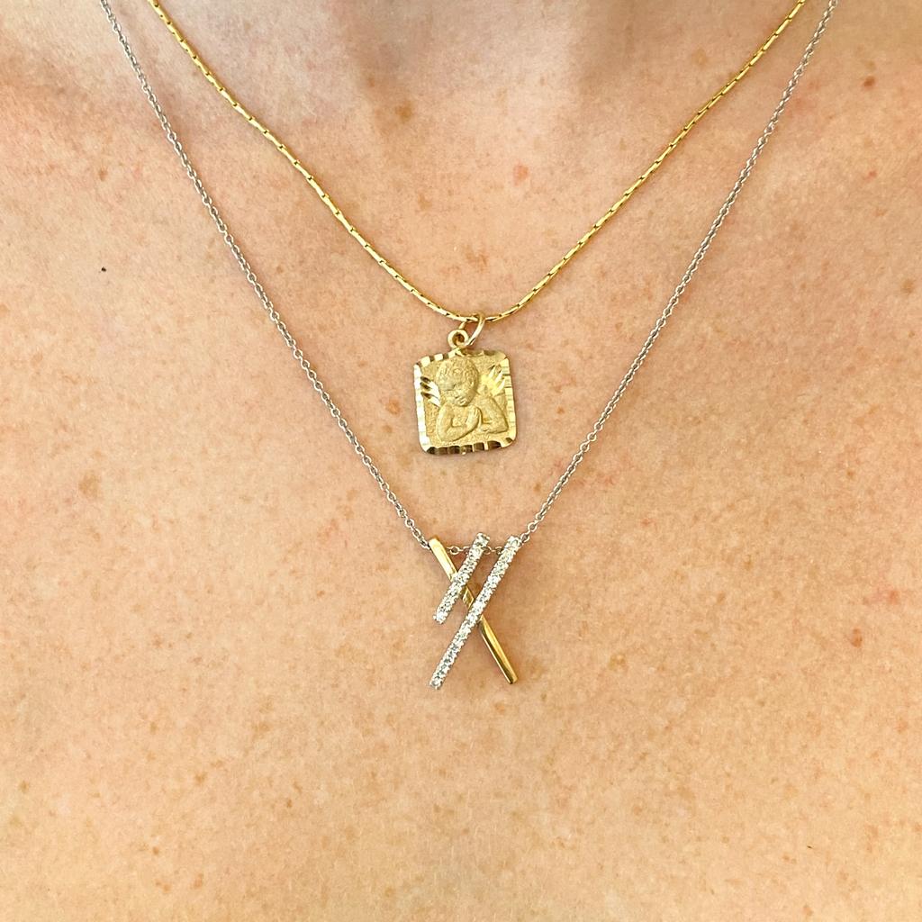 Celebrate the love of a mother and child with this sweet double 'X' pendant necklace. Mom and kiddo are each a part of the other and yet each their own person. This would be a perfect Mother's Day gift or other special gift to celebrate a mom! The