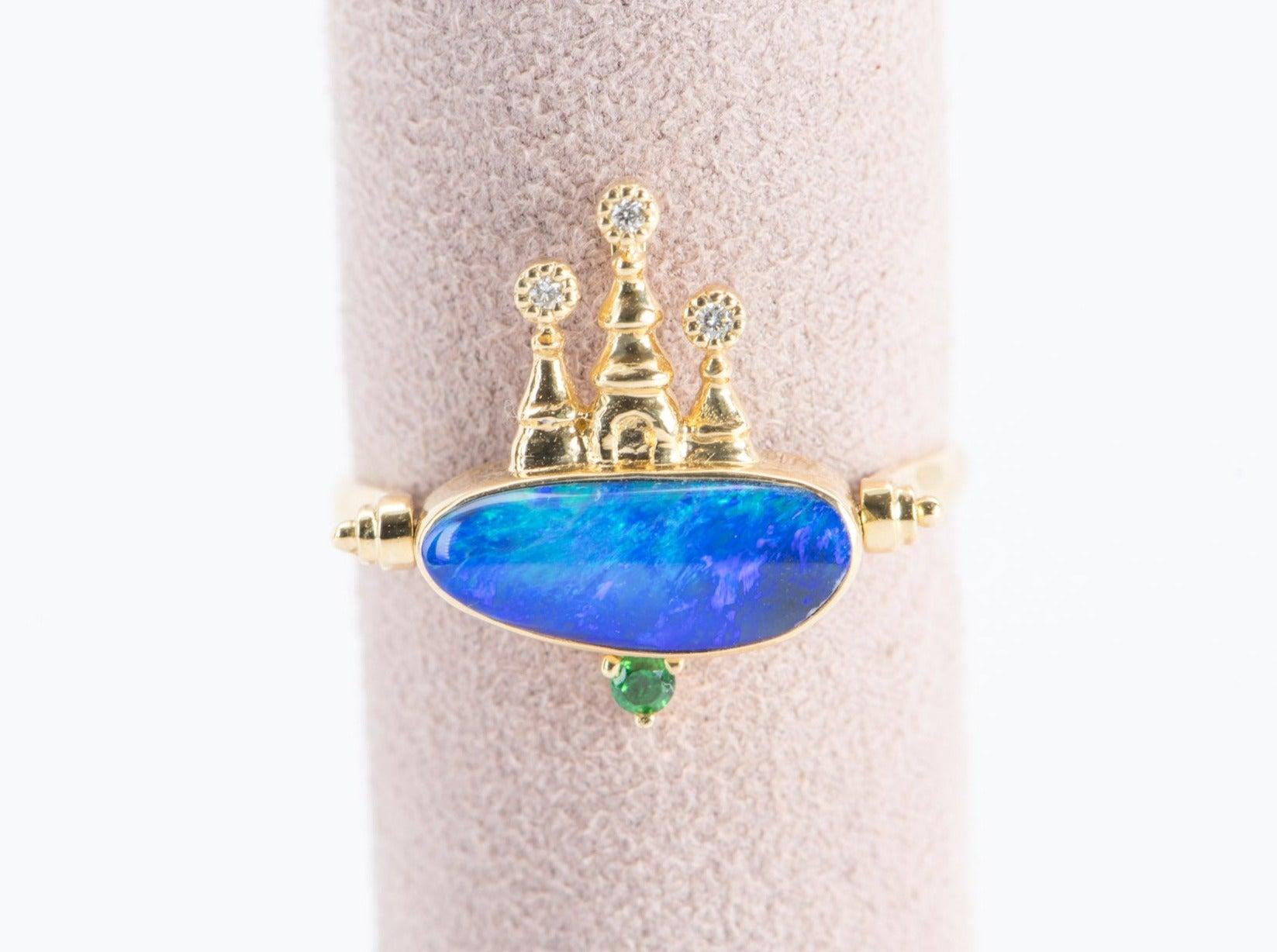 ♥ Solid 18k yellow gold castle pendant set with a beautiful doublet Australian Opal, diamonds, and tsavorite

♥This pendant can also be converted into a ring
♥ Gorgeous blue color!
♥ The item measures 16.2 mm in length, 12.6 mm in width, and is 5 mm