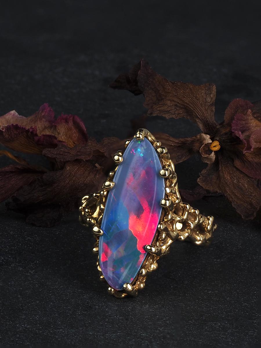 18K yellow gold ring with doublet of a natural black opal on a petrified wood base
opal origin - Australia 
opal measurements - 0.12 х 0.35 х 0.94 in / 3 х 9 х 24 mm
ring size - 7 US
ring weight - 8.23 grams


We ship our jewelry worldwide – for our