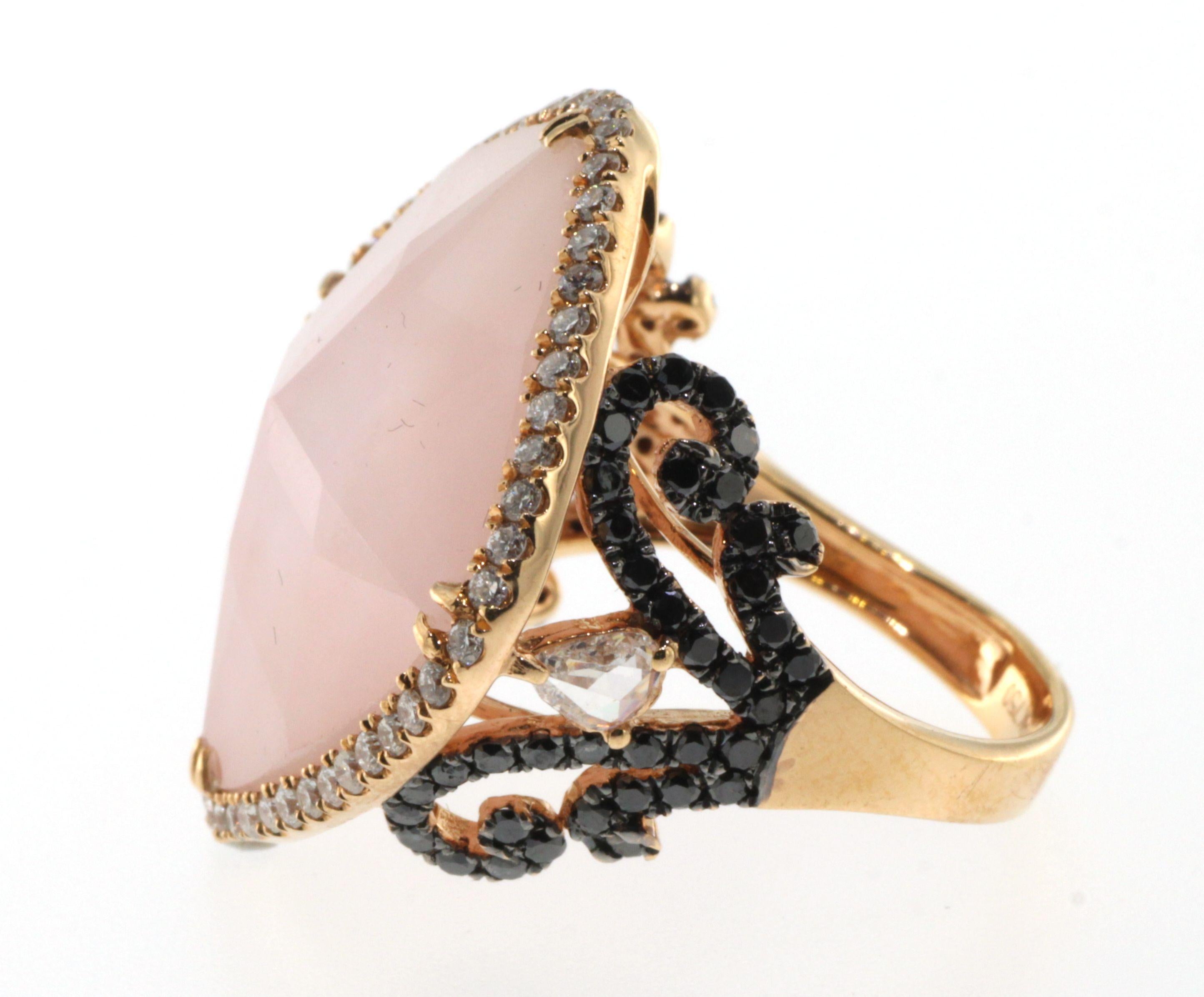Introducing an exquisite and unique piece of jewelry - our Pink Opal and Rock Crystal Ring. Handcrafted with precision, this ring showcases the natural variations in the Pink Opal slices and is topped off with clear faceted rock crystal. The setting