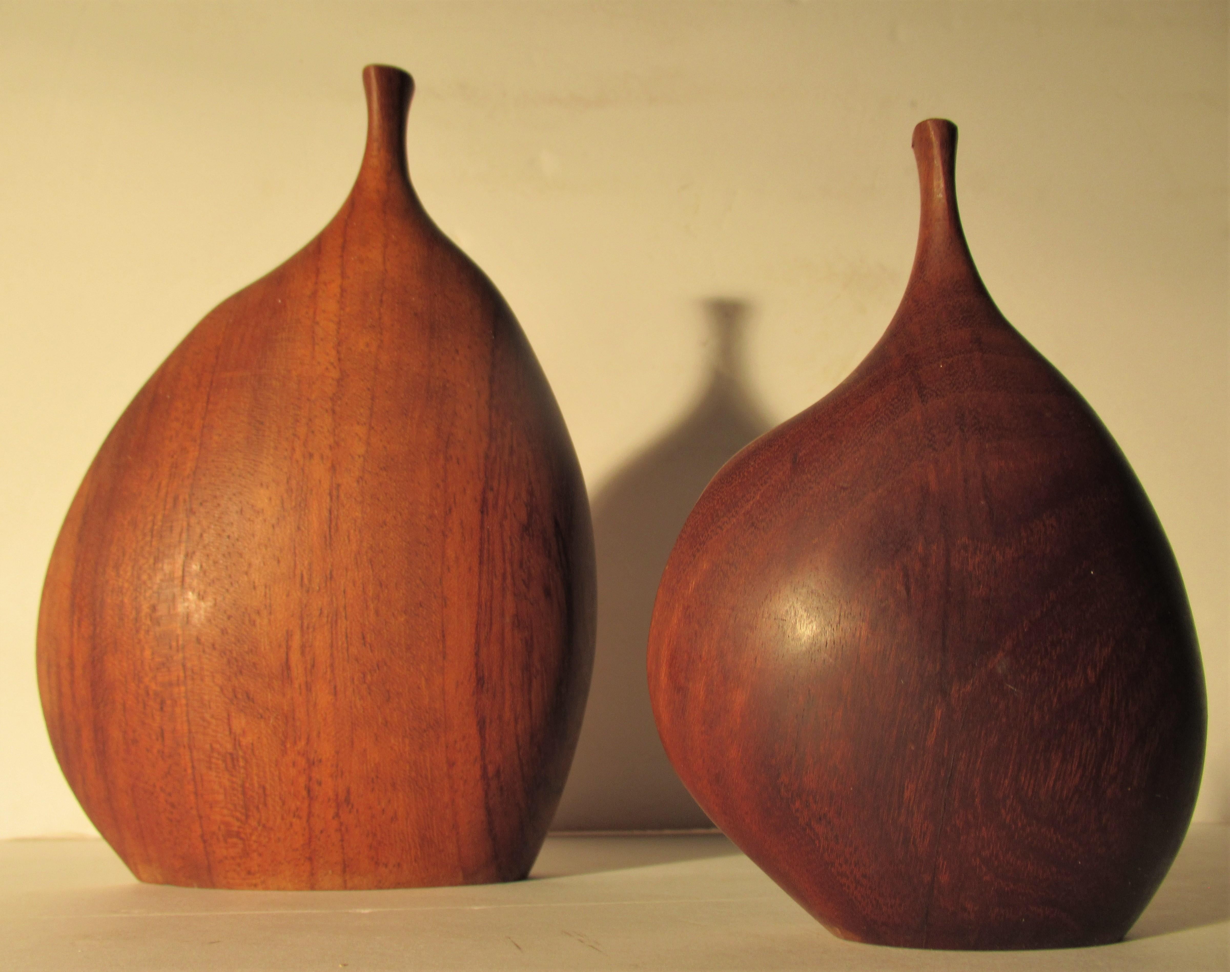 Very fine organic modern biomorphic form carved wood sculpture bud vases / weed pots. The larger is signed D. Ayers / African Bubinga /  7-75. The smaller is not signed but both seem to be by the same hand. The larger vase measures 7