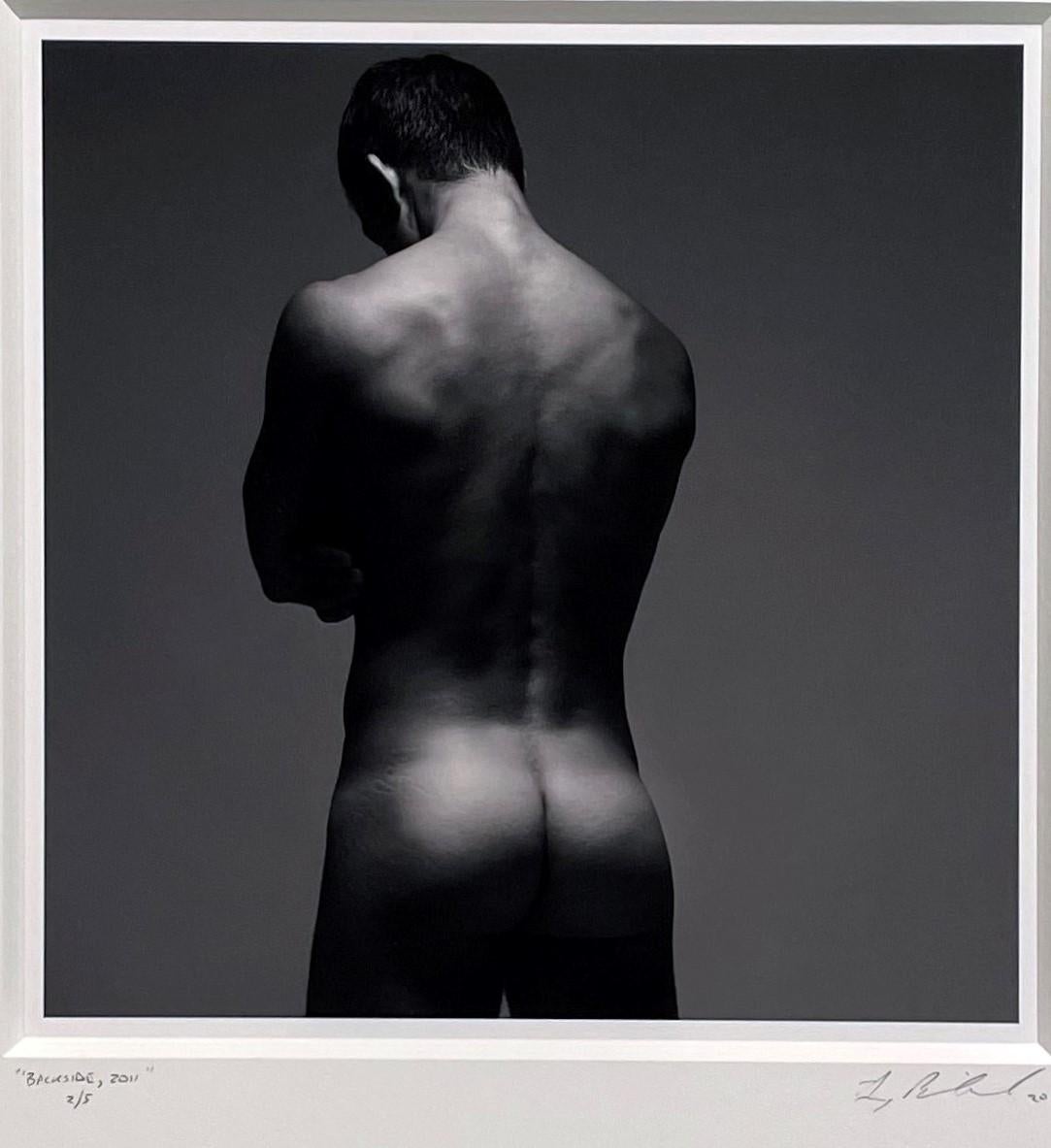 The gorgeous muscular physique of the nude male in Doug Birkenheuer's photograph titled 