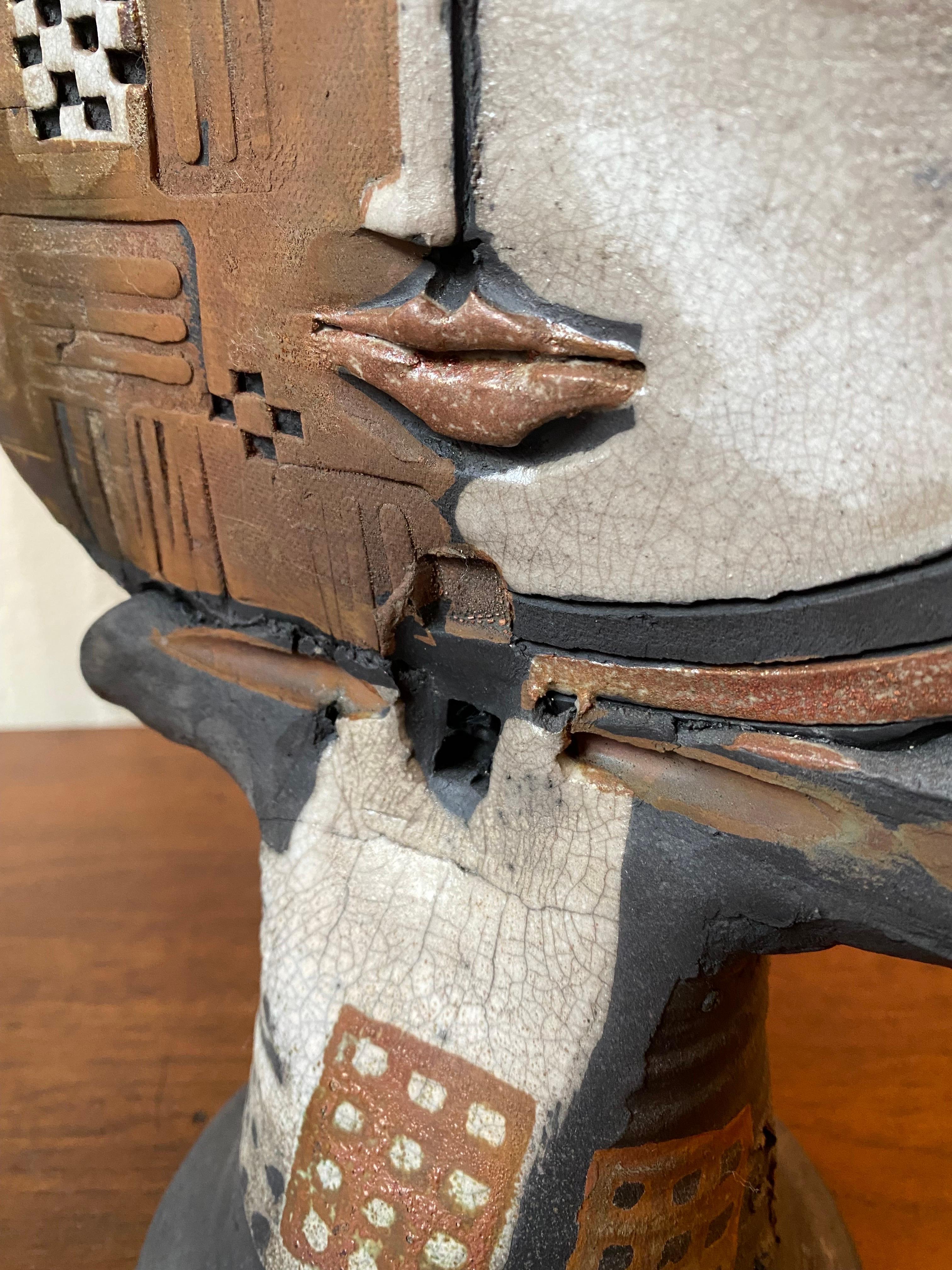 Doug Delind Raku-Fired Ceramic 2 sided face Sculpture. Signed on side of base. In nice original condition! Face shows some lines in the glaze as seen in photos.