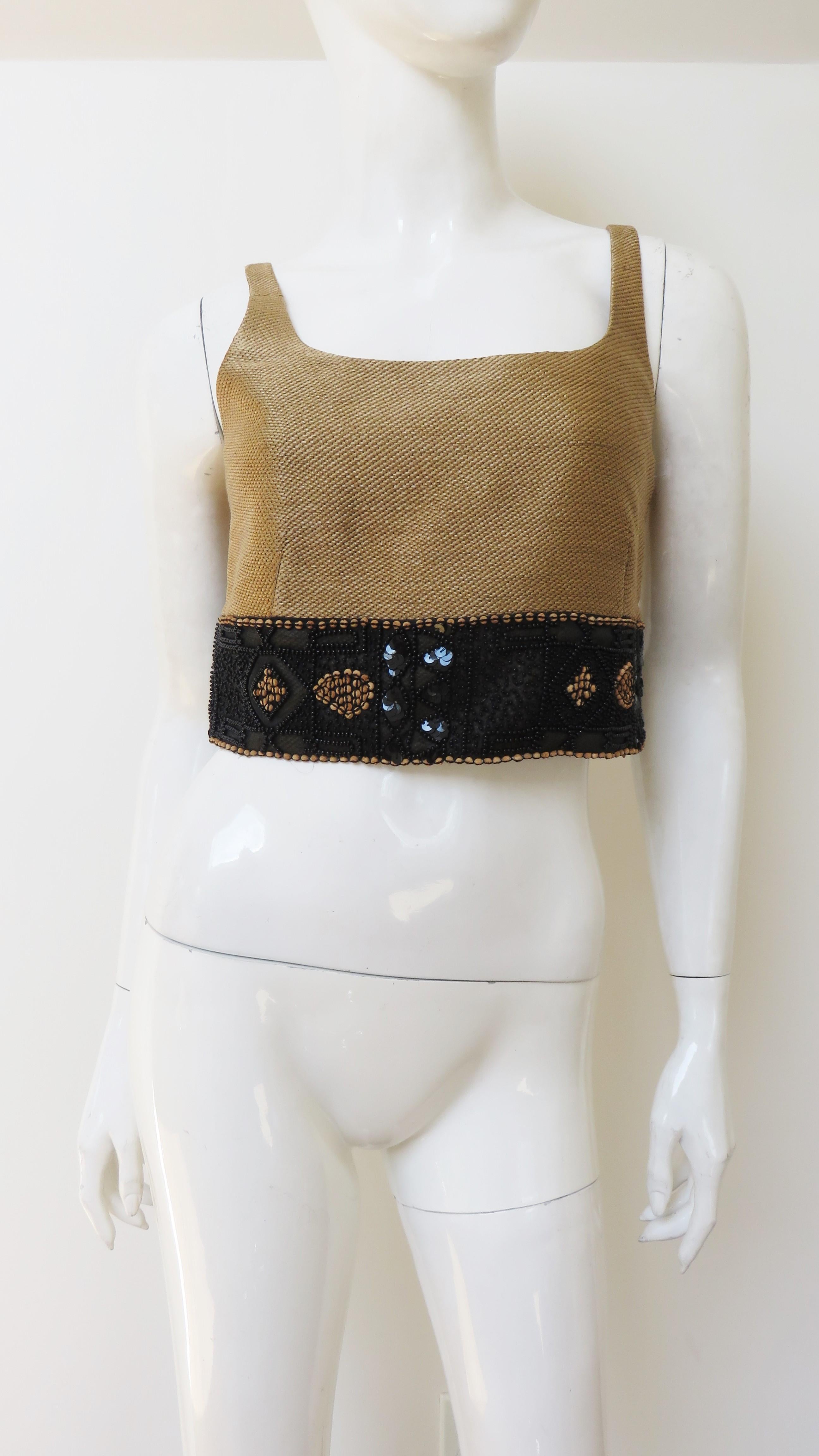 A fabulous tan scoop neck crop top with a black elaborately glass beaded band around the bottom from Douglas Anderson.  It is fully lined and has a side zipper.
New without tags.  Marked US size 8.

Bust  17