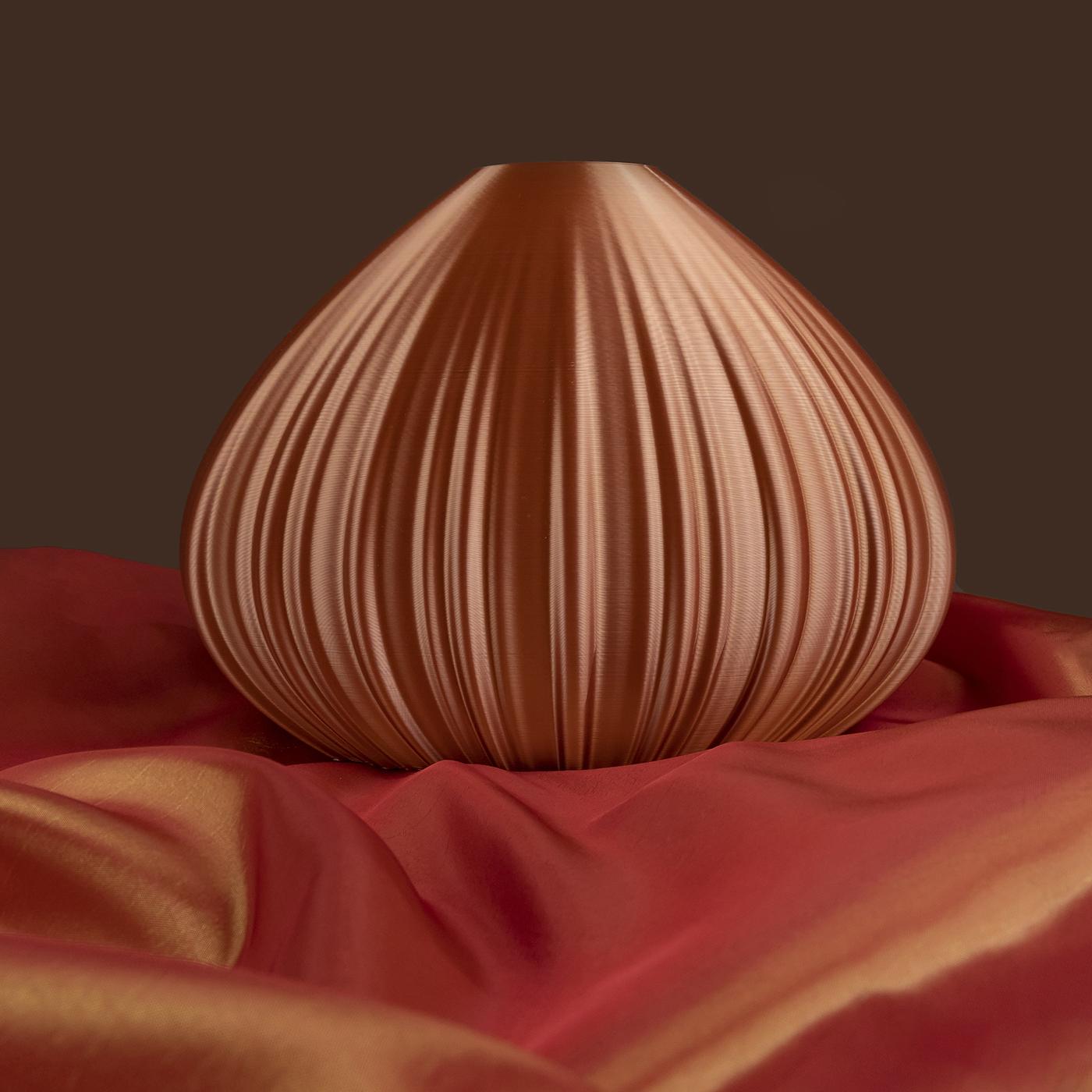 Showcasing an elegant drop-shaped profile, this gorgeous decorative sculpture is a singular objet d'art recalling a chestnut. Fashioned of sustainable materials, its organic resin silhouette is finished in a mesmerizing brown shade enhanced with a