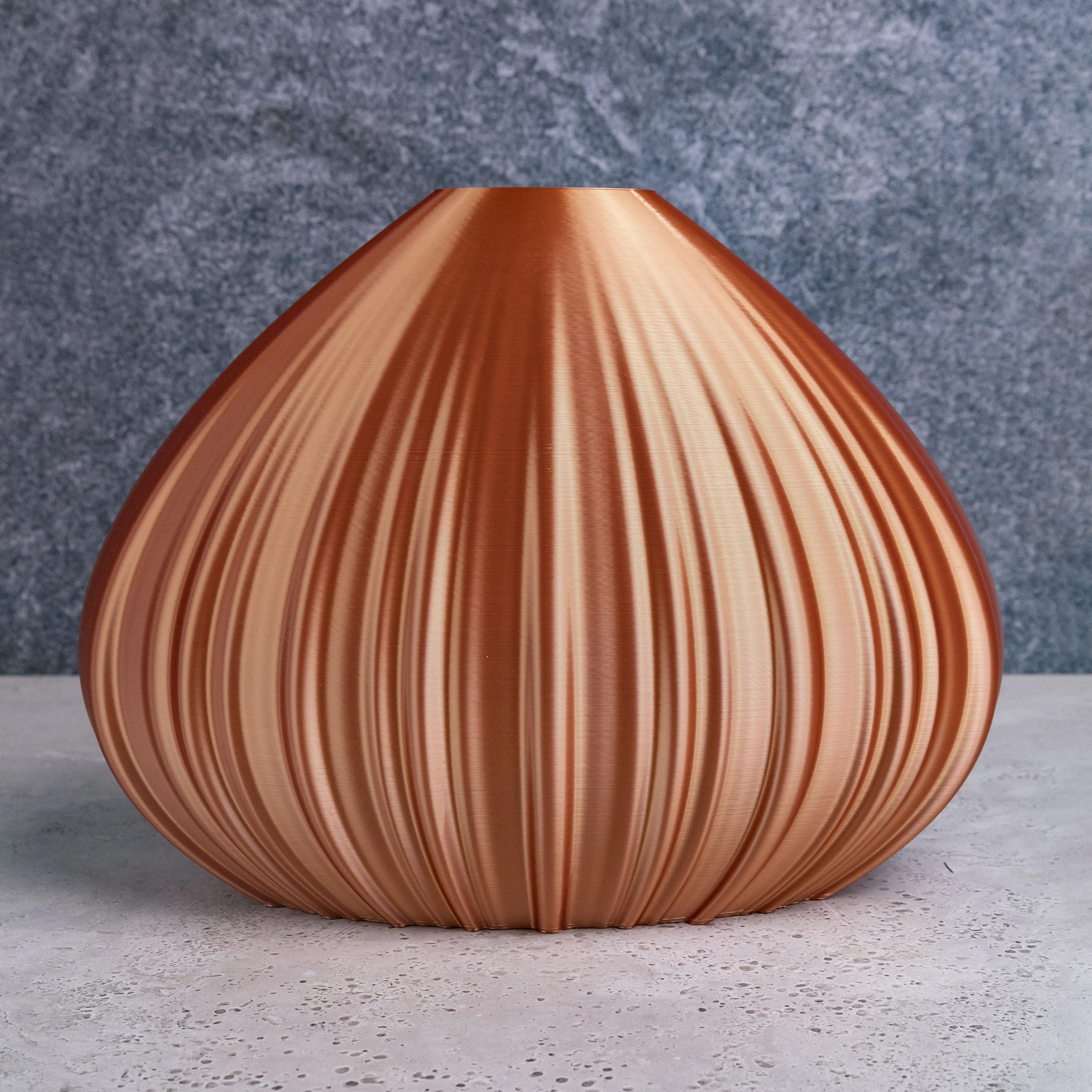 Vase-sculpture by DygoDesign

Showcasing an elegant drop-shaped profile, this gorgeous decorative sculpture is a singular design vase inspired by a chestnut. Fashioned of sustainable materials, its organic silhouette is finished in a mesmerizing