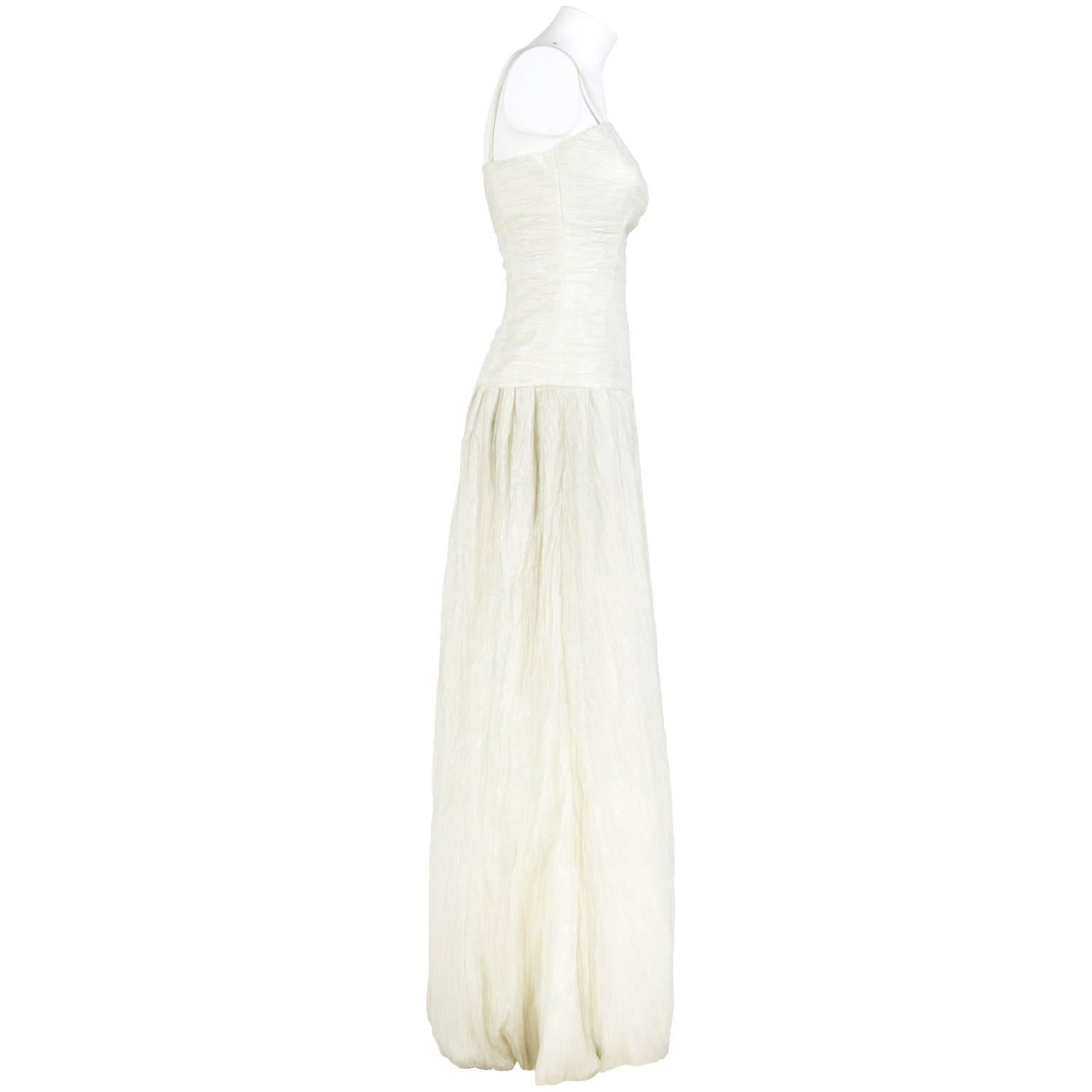 Beautiful Douglas wedding dress in cream color with thin straps and wide skirt lightly pleated. The item was produced in the 2000s and is in excellent conditions.
Height: 150 cm
Bust: 38 cm
Waist: 32 cm