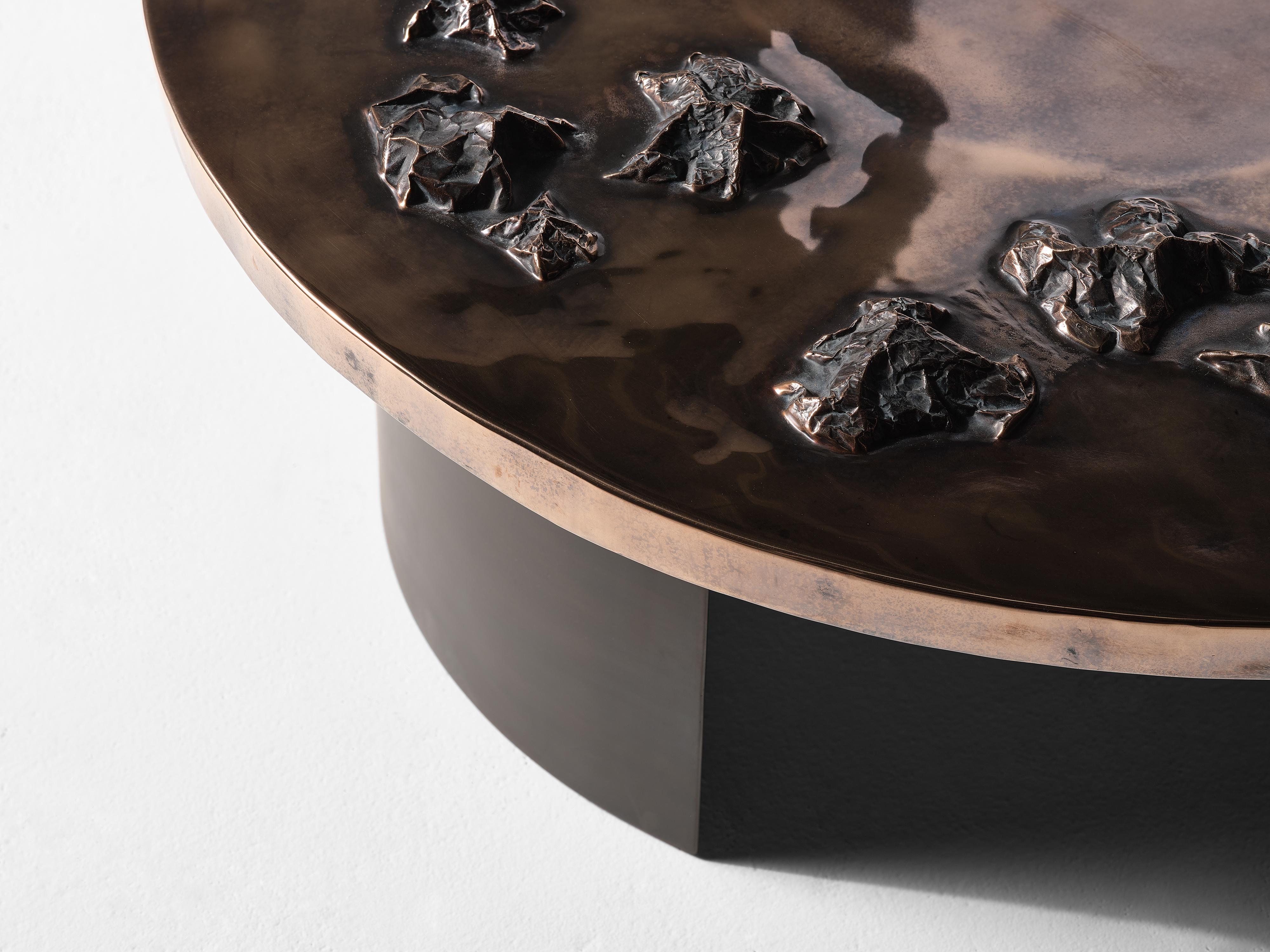 Master metalsmith Douglas Fanning's extra elegant coffee table features an extended series of topographical crests spanning abutting a third of its smooth top. Fanning, always eager to explore new territories in form and material, has in this case