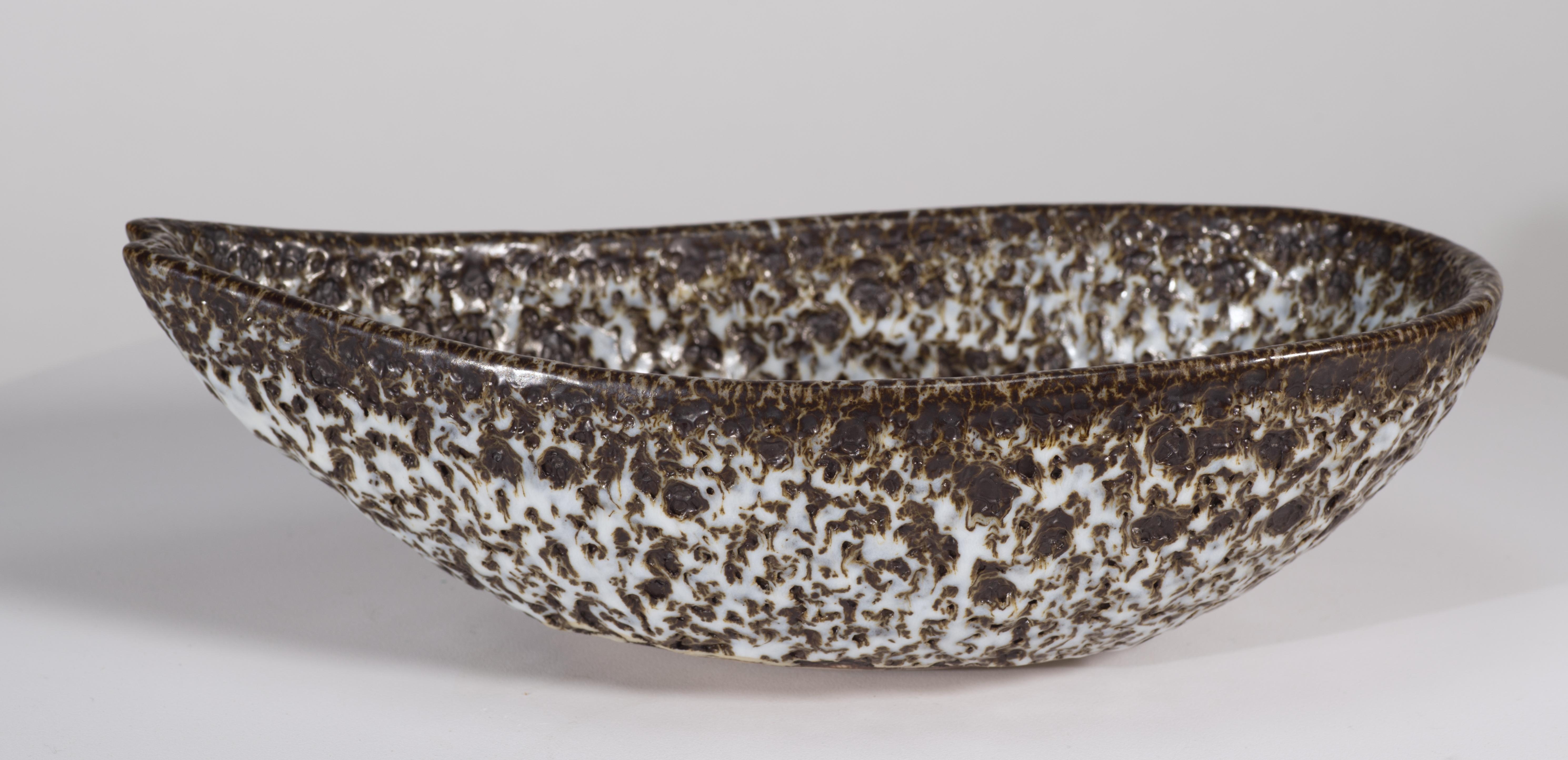  Vintage hand-thrown bowl features complex Crater glaze in off-white and espresso brown colors. Minimal color palette and streamlined shape of the piece allow the textured glaze with variations from semi-matte to high gloss to take the spotlight;