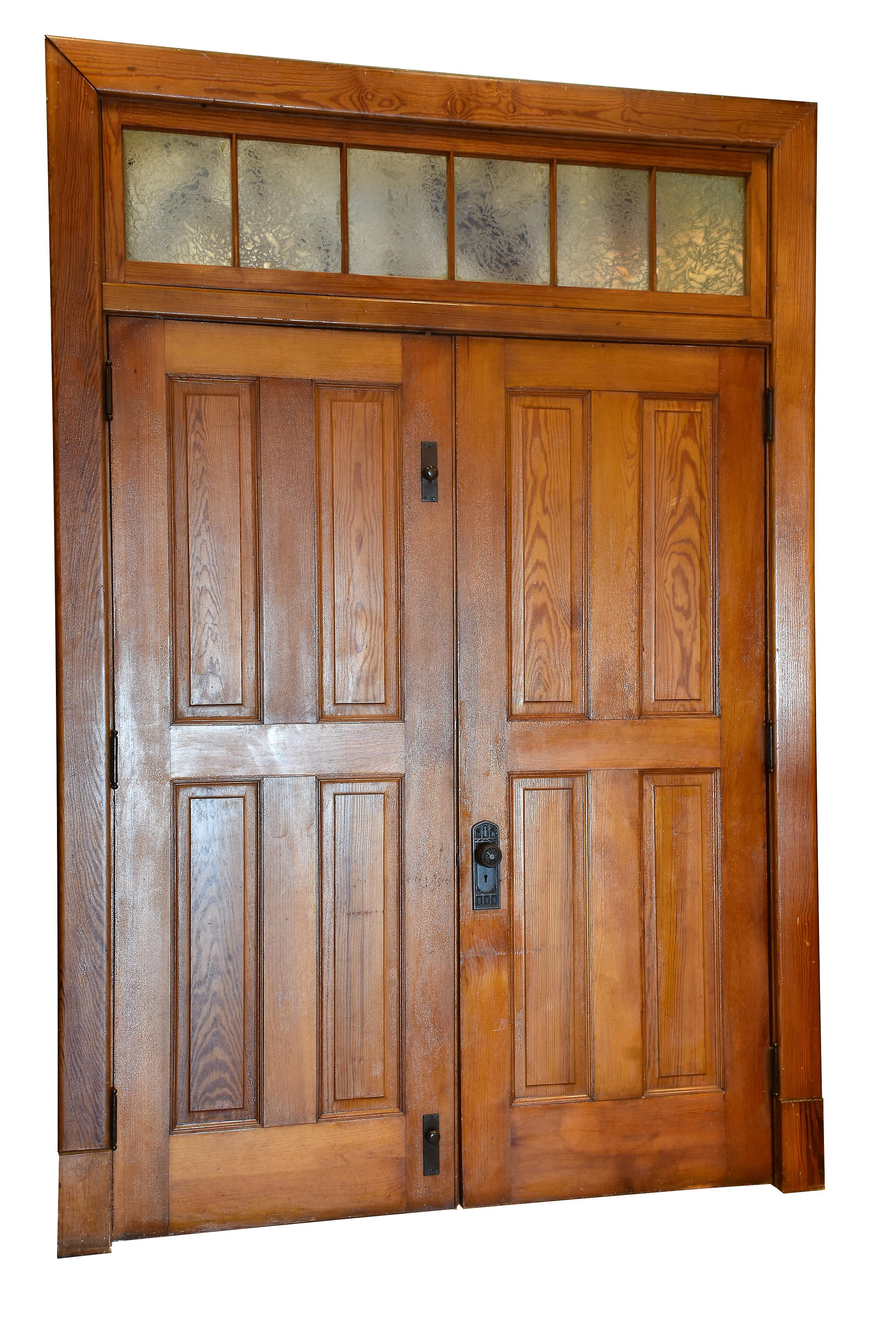 This old growth Douglas Fir double door with transom unit is uniquely pristine with 4 panel doors and original glue-chip glass transom. This rare door unit would bring great historical character to any room! The original finish, complete wood jam,