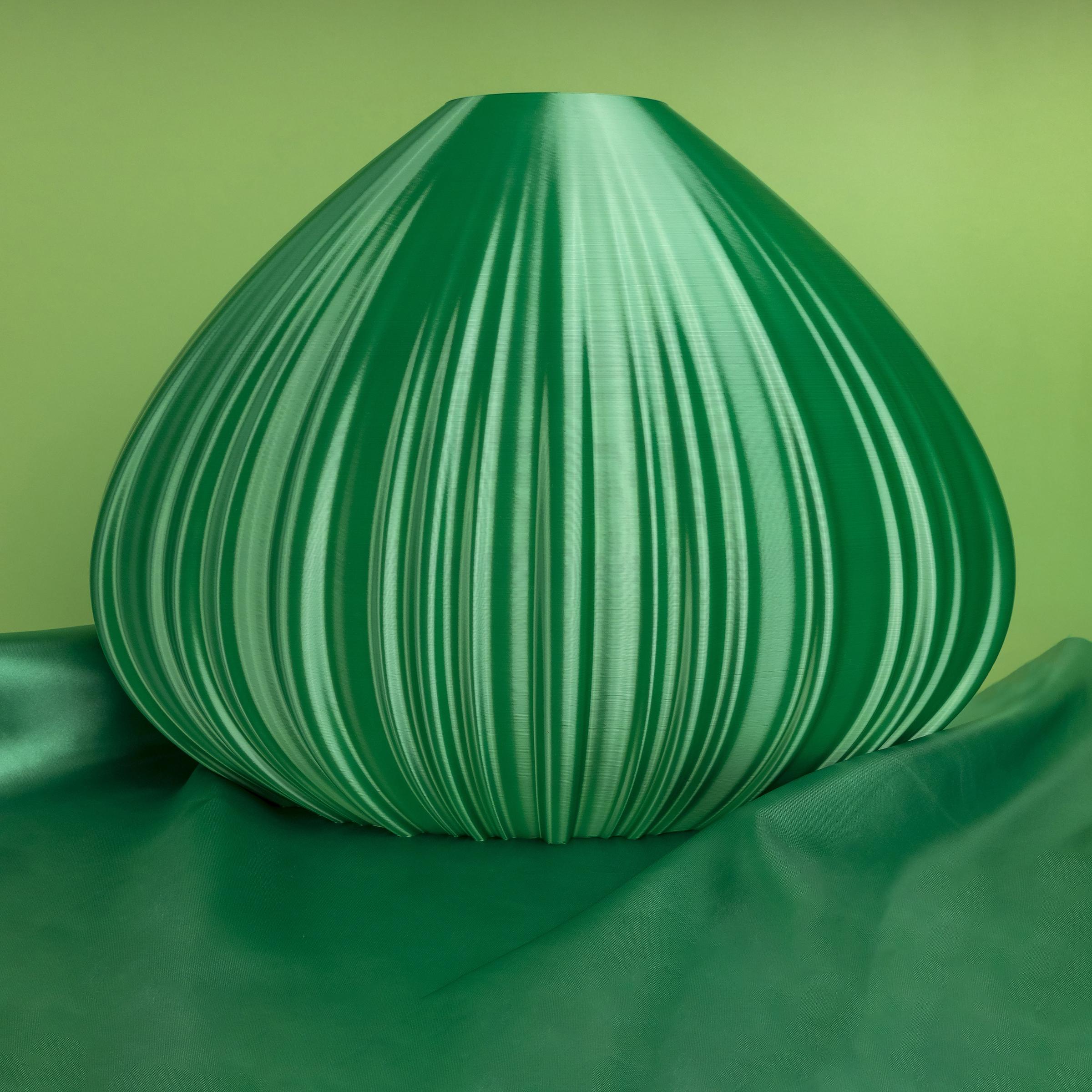 Vase-sculpture by DygoDesign

Showcasing an elegant drop-shaped profile, this gorgeous decorative sculpture is a singular design vase inspired by a chestnut. Fashioned of sustainable materials, its organic silhouette is finished in a mesmerizing
