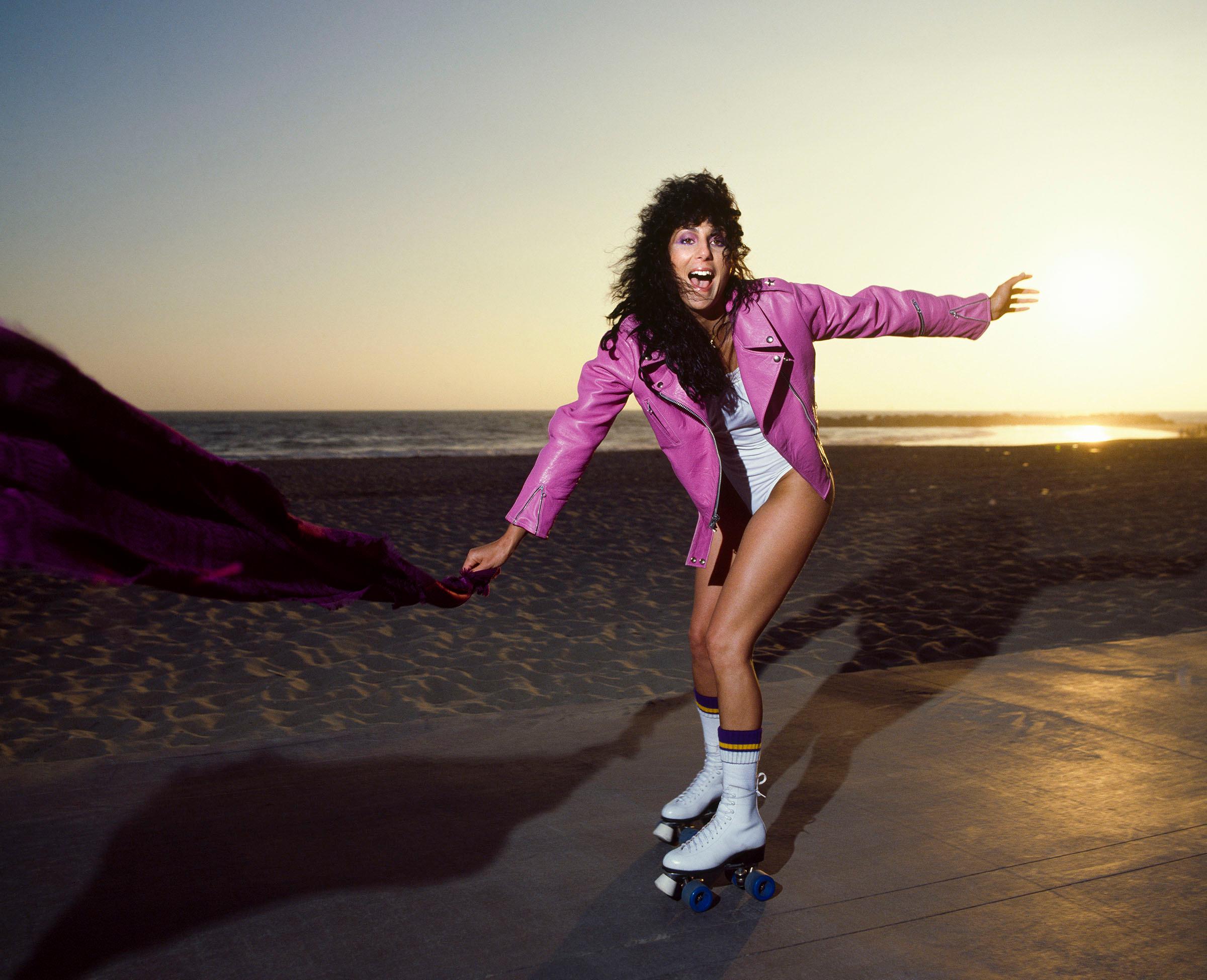 Douglas Kirkland Color Photograph - Cher Rollerskating On Venice Beach, 1979