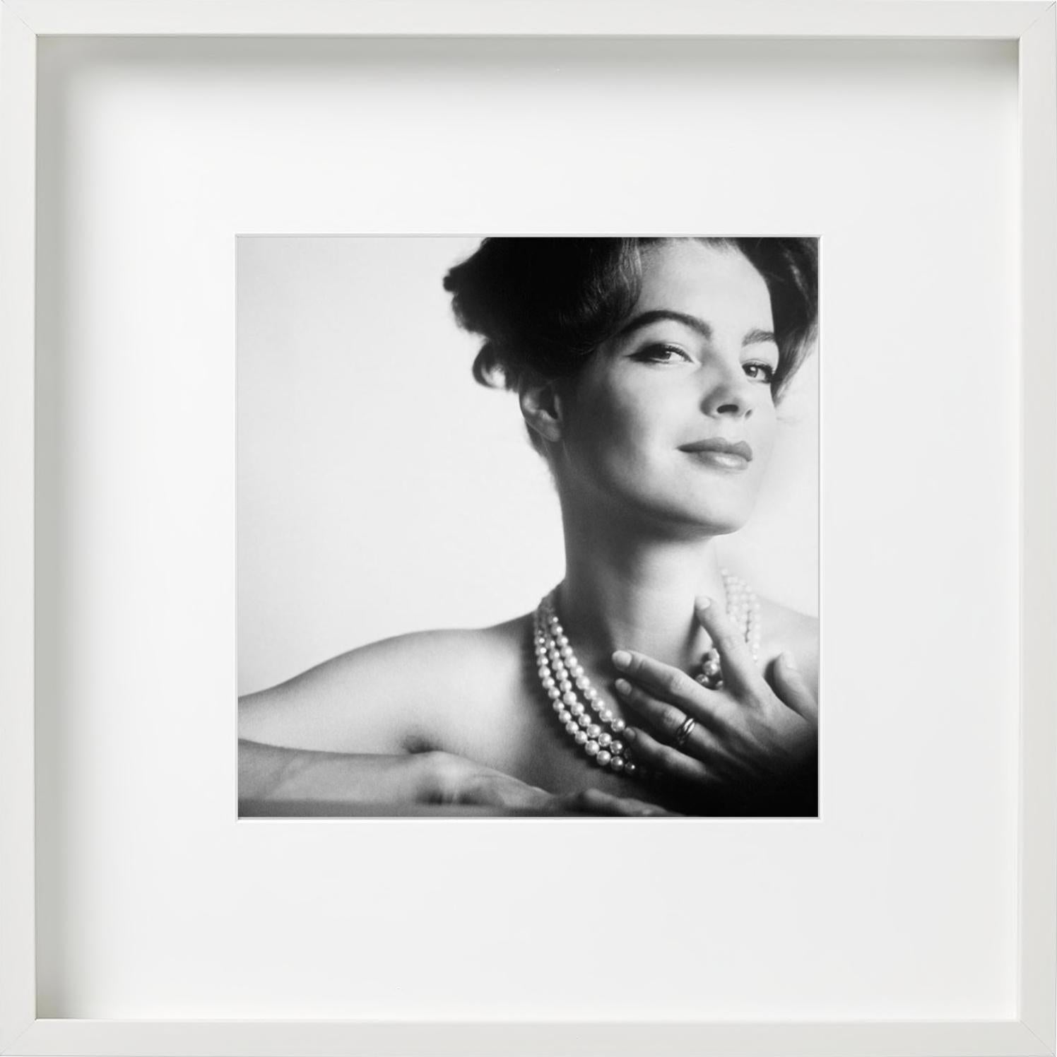 Portrait of romy schneider, almost naked only with a pearl necklace touching her - Contemporary Photograph by Douglas Kirkland
