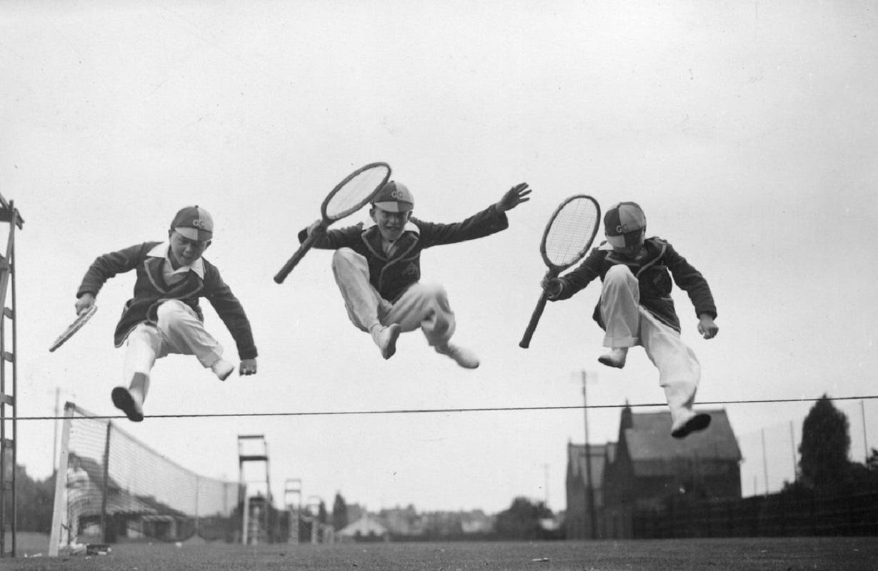 "Tennis Leap" by Douglas Miller

22nd August 1932: Three young competitors leaping over the boundary between two tennis courts at the Essex Junior Championships at Westcliff-on-Sea.

Unframed
Paper Size: 20" x 24'' (inches)
Printed 2022 
Silver