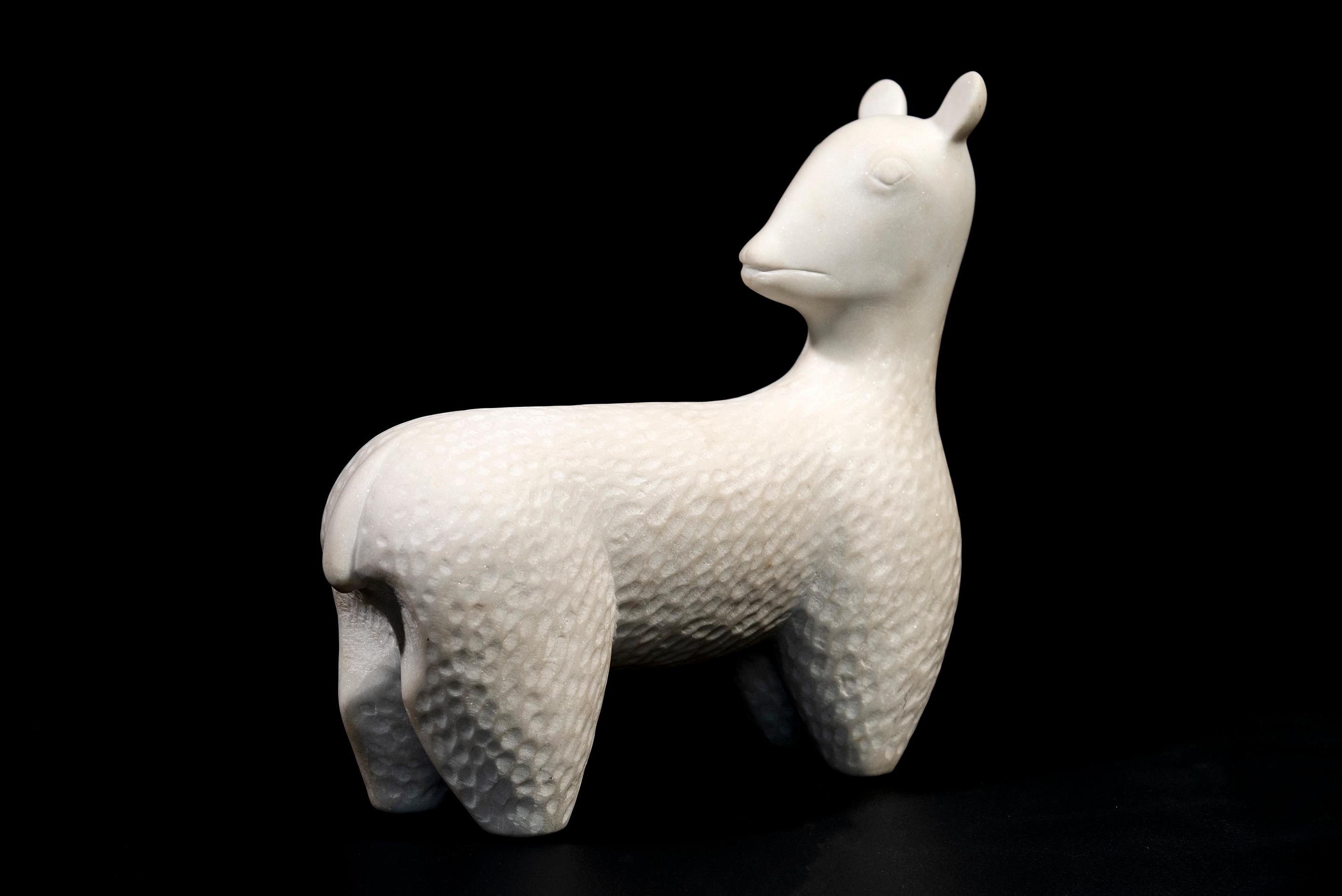 Sculpted from white Carrara marble, this charming table top sculpture of a goat is by Doug Robinson. In Italian ‘Capra’ means a female or nanny goat—a common sight in the countryside where Robinson has lived since the 1970’s. As a young man, the