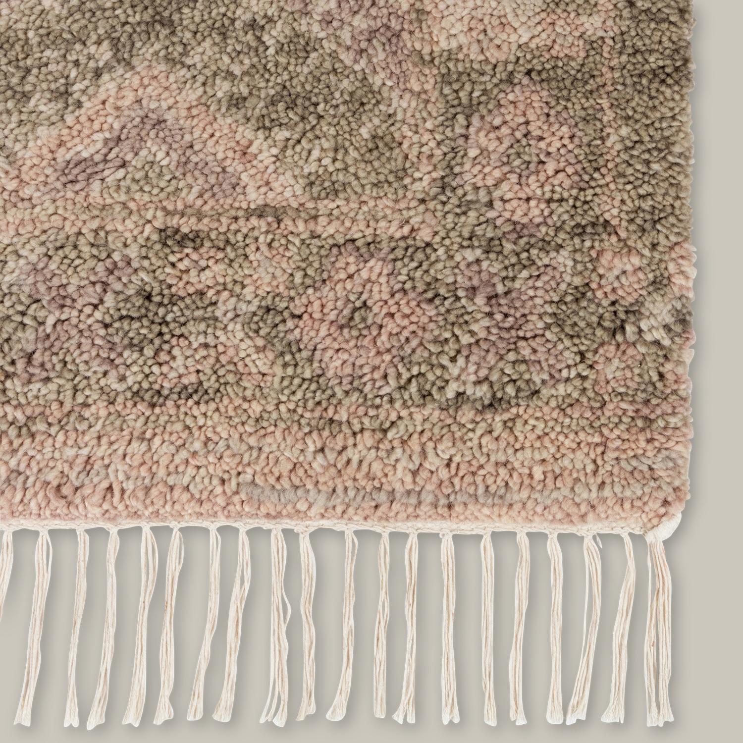 Traditional Moroccan rag rugs inspire the Doukkala Collection. Hand knotted out of wool, the pile is hand-shorn to create an irregularity in the look, forming a thick, almost cloud-like texture underfoot. The loosest interpretations of a Moroccan