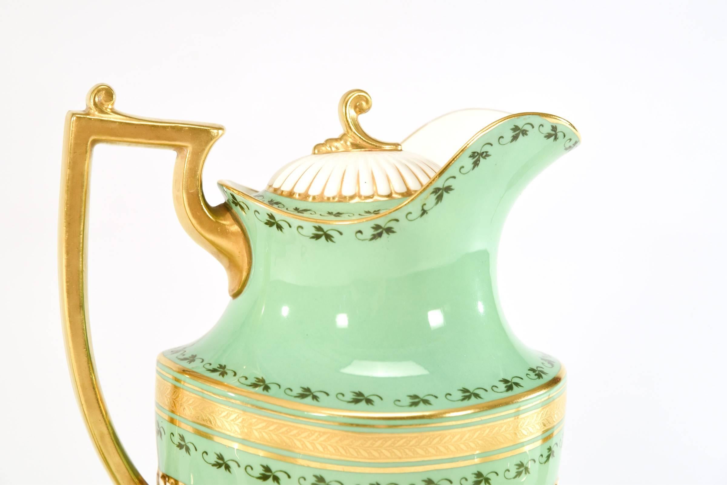 This is a rare shape and specialized set that features beautiful cups with stylized handles unique to hot chocolate cups. Chocolate was a rare and expensive commodity that was very thick and viscous thus the short spout.
The elegant handle added to
