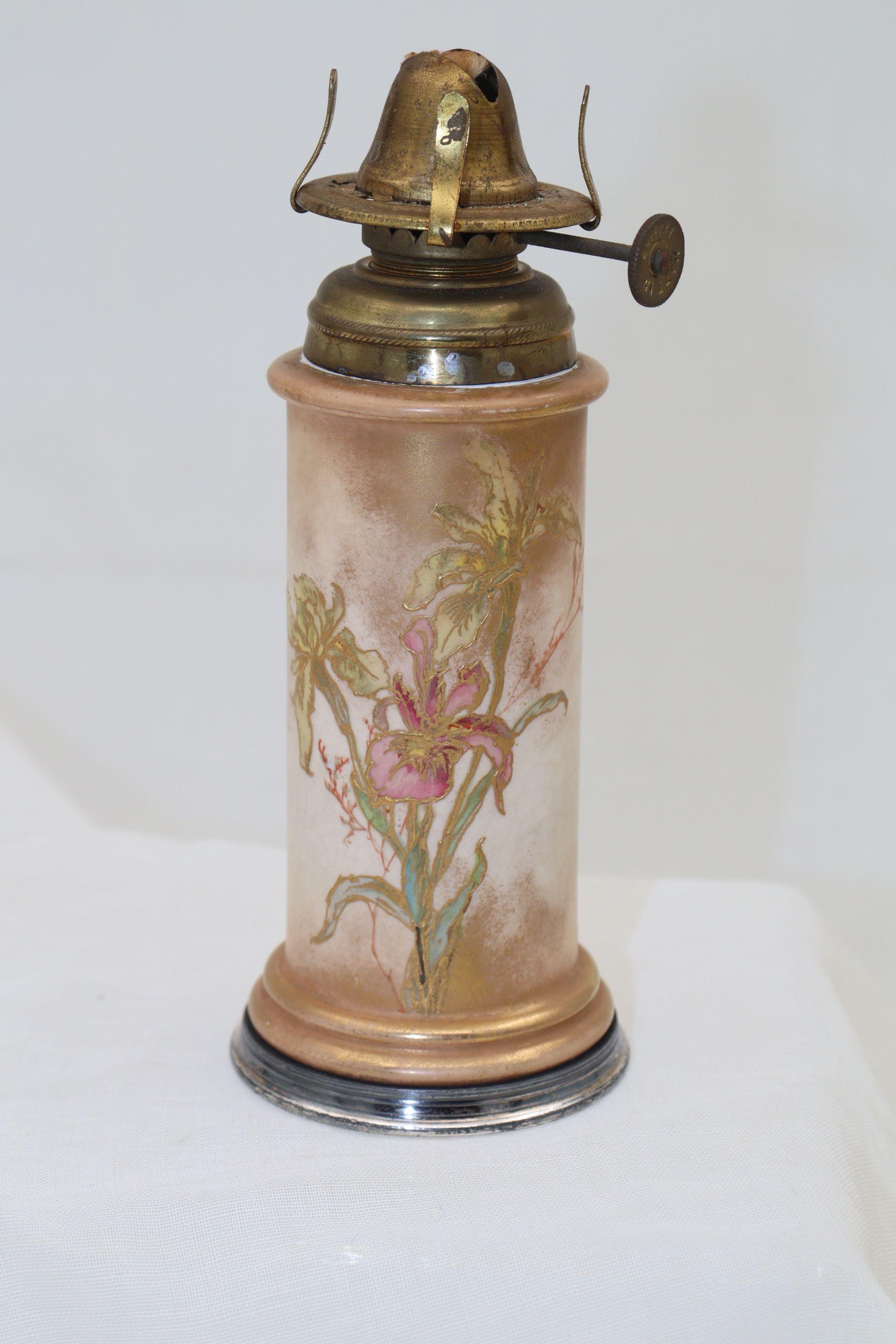 This small Doulton Burslem oil lamp base was decorated by George Fernyhough, who was at Doulton Burslem from around 1887 until 1905. The decoration consists of hand painted flowers and foliage outlined with raised gilding on a buff coloured ground,