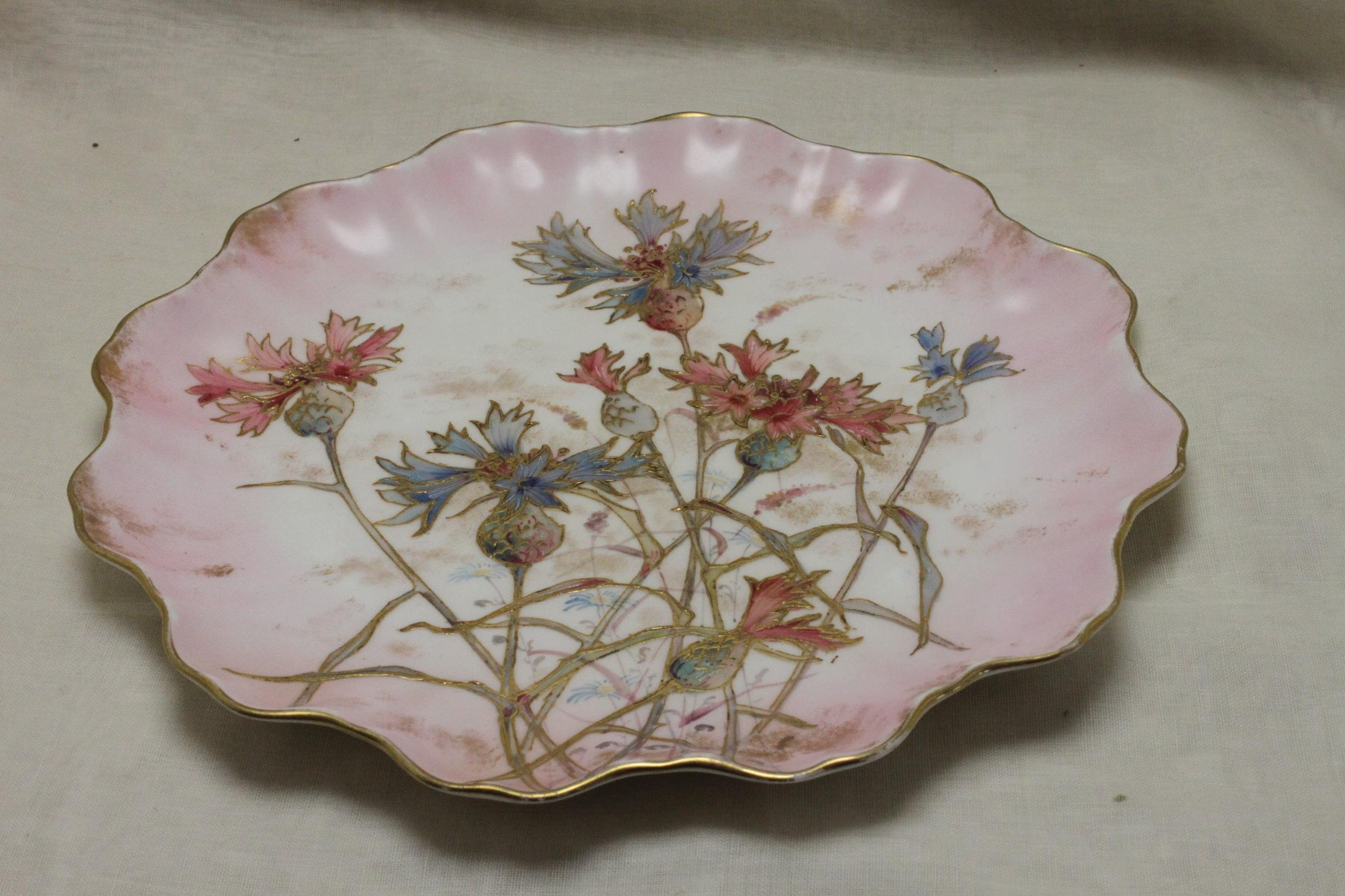 This porcelain plate from Doulton Burslem is decorated with Doulton's 