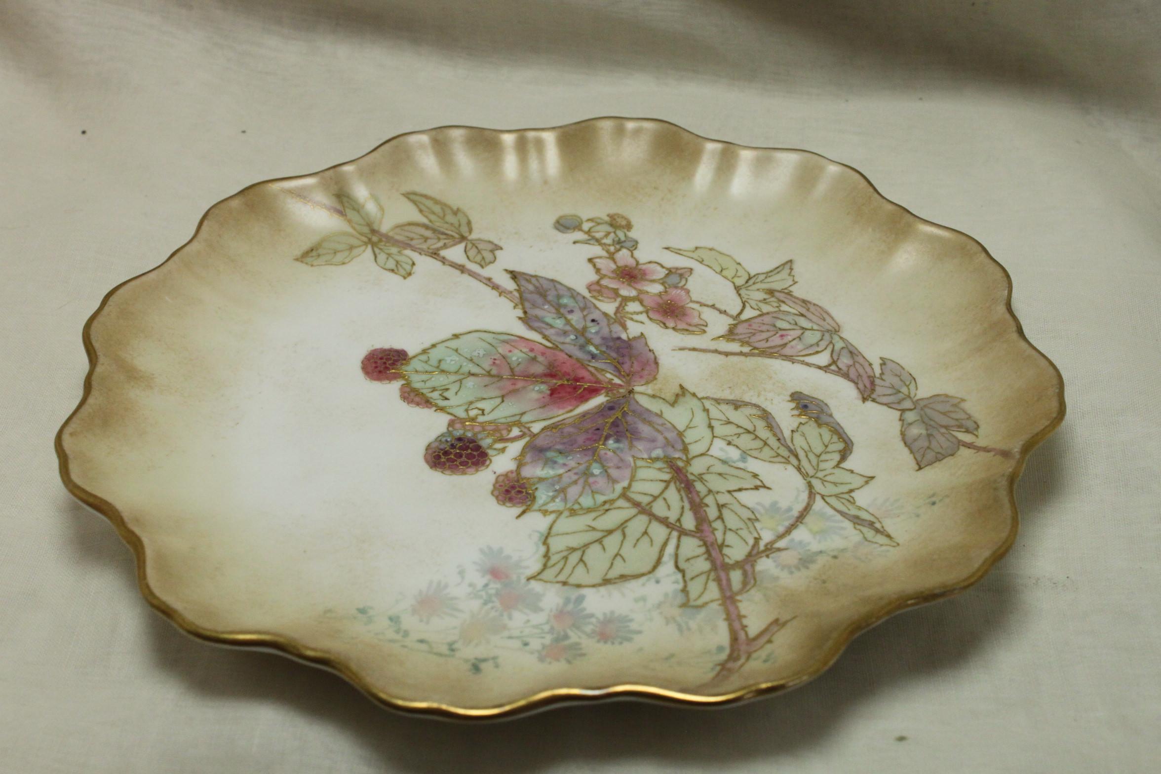 This porcelain plate from Doulton Burslem is decorated with s design from Doulton's 