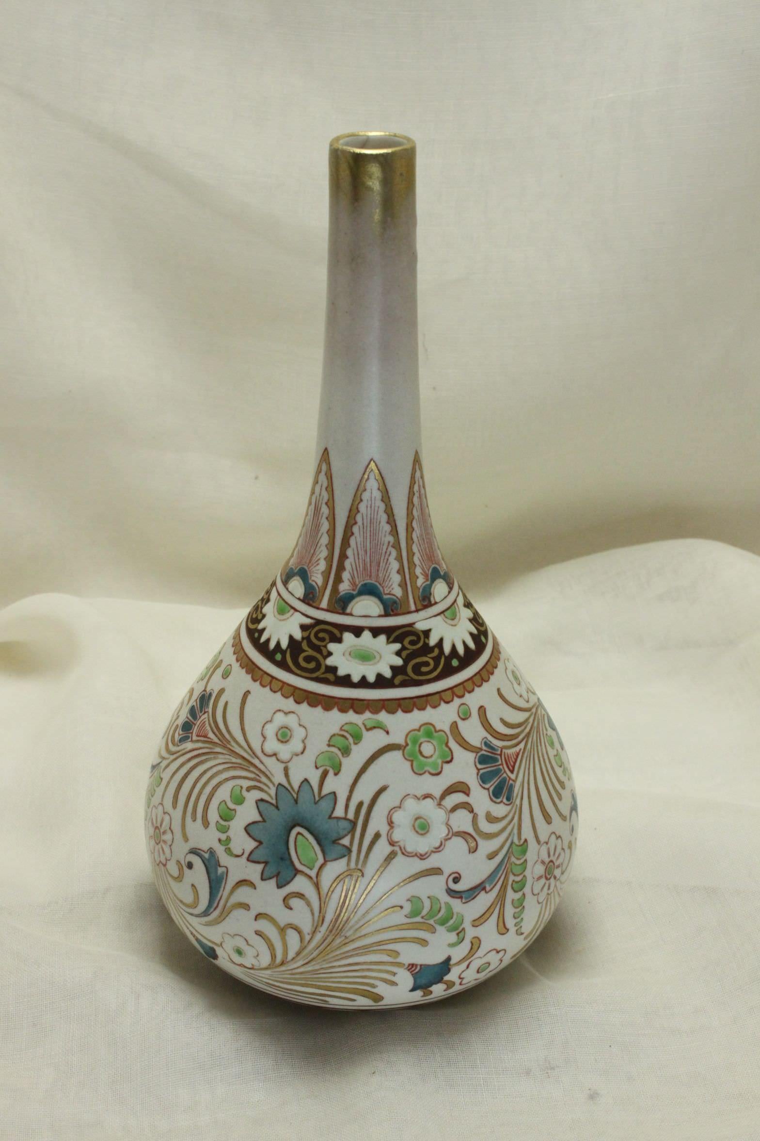 This bottle-shaped Doulton Lambeth specimen vase is from the Carrara Ware range which was a stoneware range of moderate output made between about 1887 and 1903. This vase was designed by Mildred B Smallfield (1862-?) who was listed as a senior