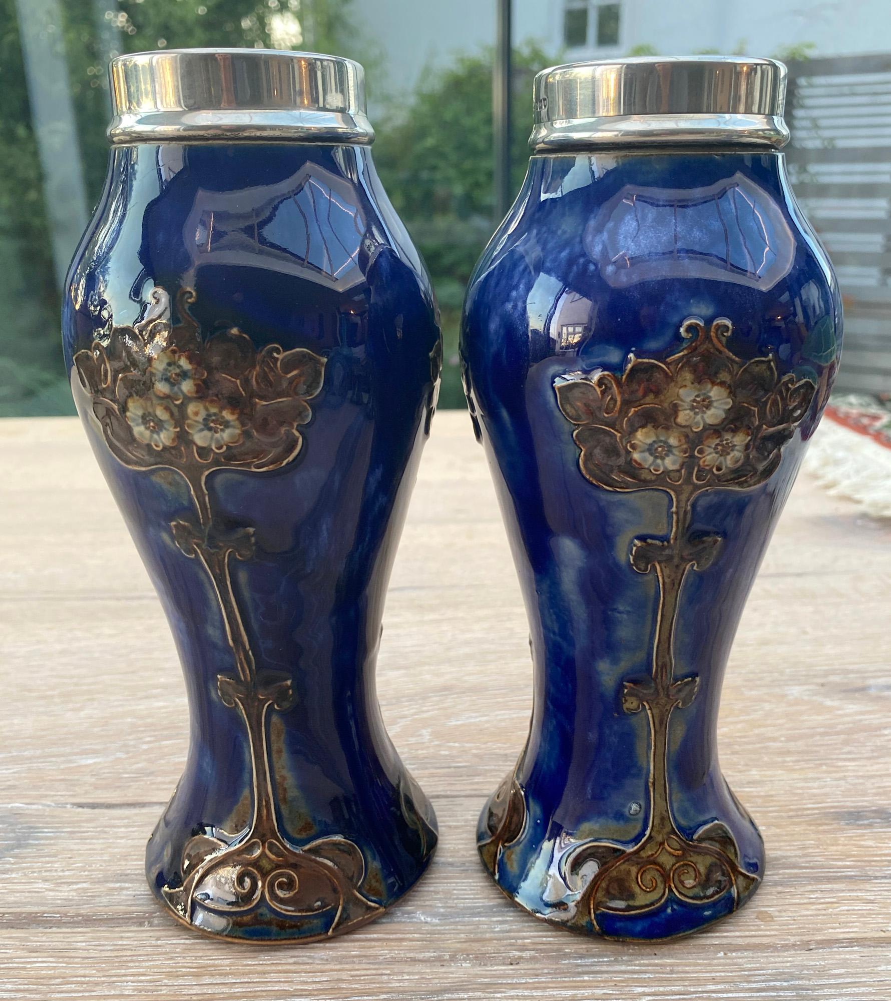 A fine collection of Doulton Lambeth art pottery spanning the Aesthetic and Art Nouveau periods comprising of:

Pair Florence Barlow vases decorated with budgerigars
Pair of Art Nouveau silver rimmed vases with tube lined stylized floral designs by