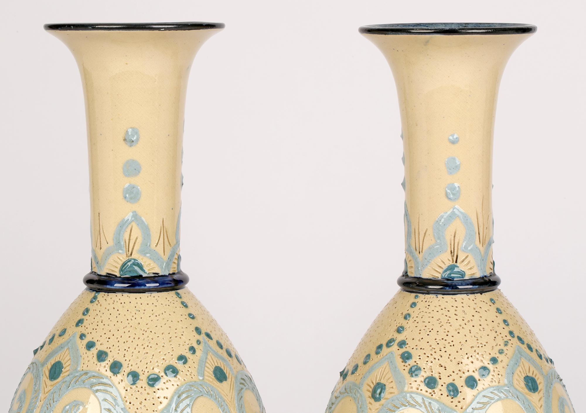 An exceptionally rare Doulton Lambeth Impasto pair of bottle vases marked Arrabian by F M Collins (Mrs Vale) dated 1879. 

F M Collins was a Faience Department artist and a pioneer in the field of Impasto painting, the successful launching of