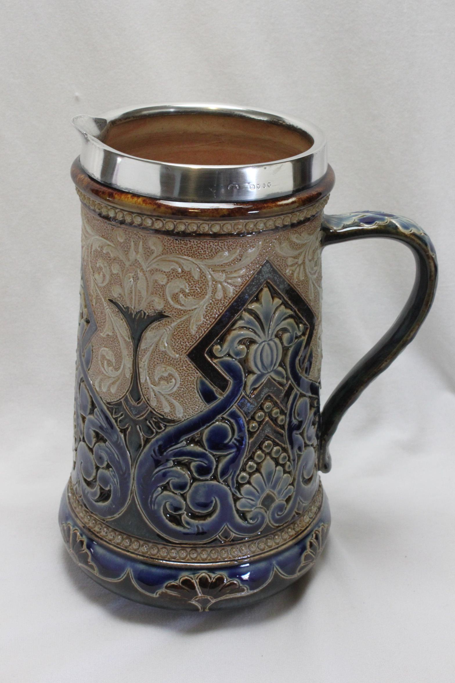 This Doulton Lambeth stoneware jug was by modelled by Eliza (or Elise as she later liked to be called ) Simmance who had a very long and very productive career at Doulton, starting in 1873 and retiring in 1928. All of the decoration on this jug was