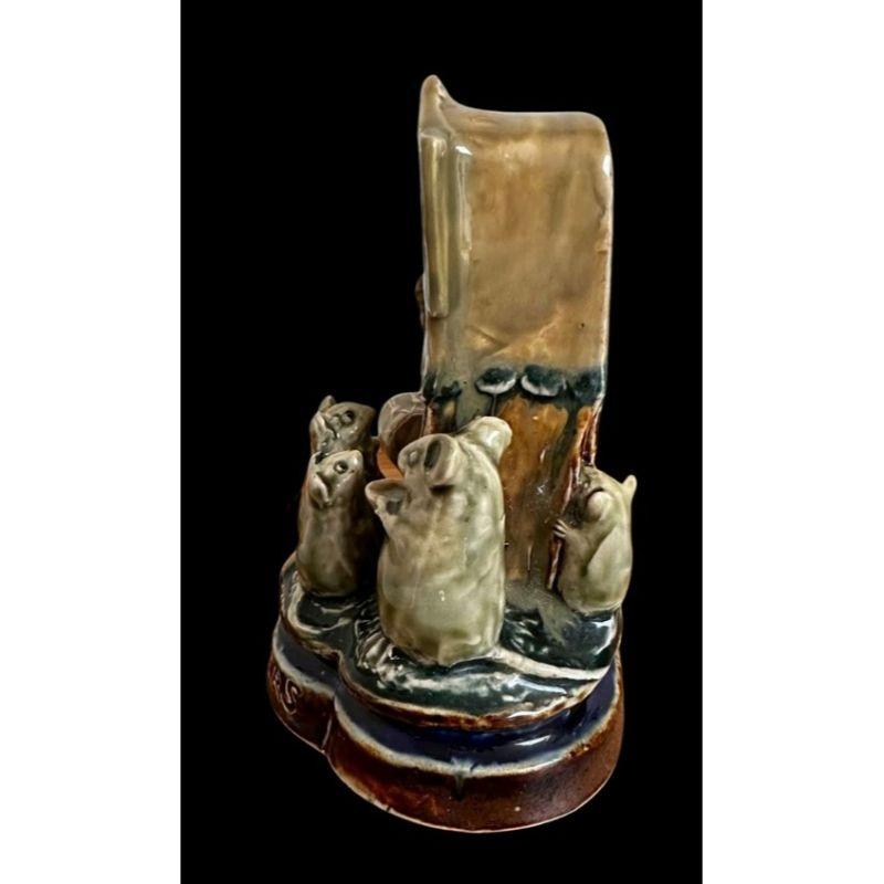 George Tinworth for Doulton Lambeth

“The Playgoers” A group of 3 mice watching a “Punch and Judy” show flanked by a Musician playing the Drums and a Mouse with a Bowl

Circa 1900

Dimensions: 14cm high, 12cm wide and 9.5cm deep

Tiny frit