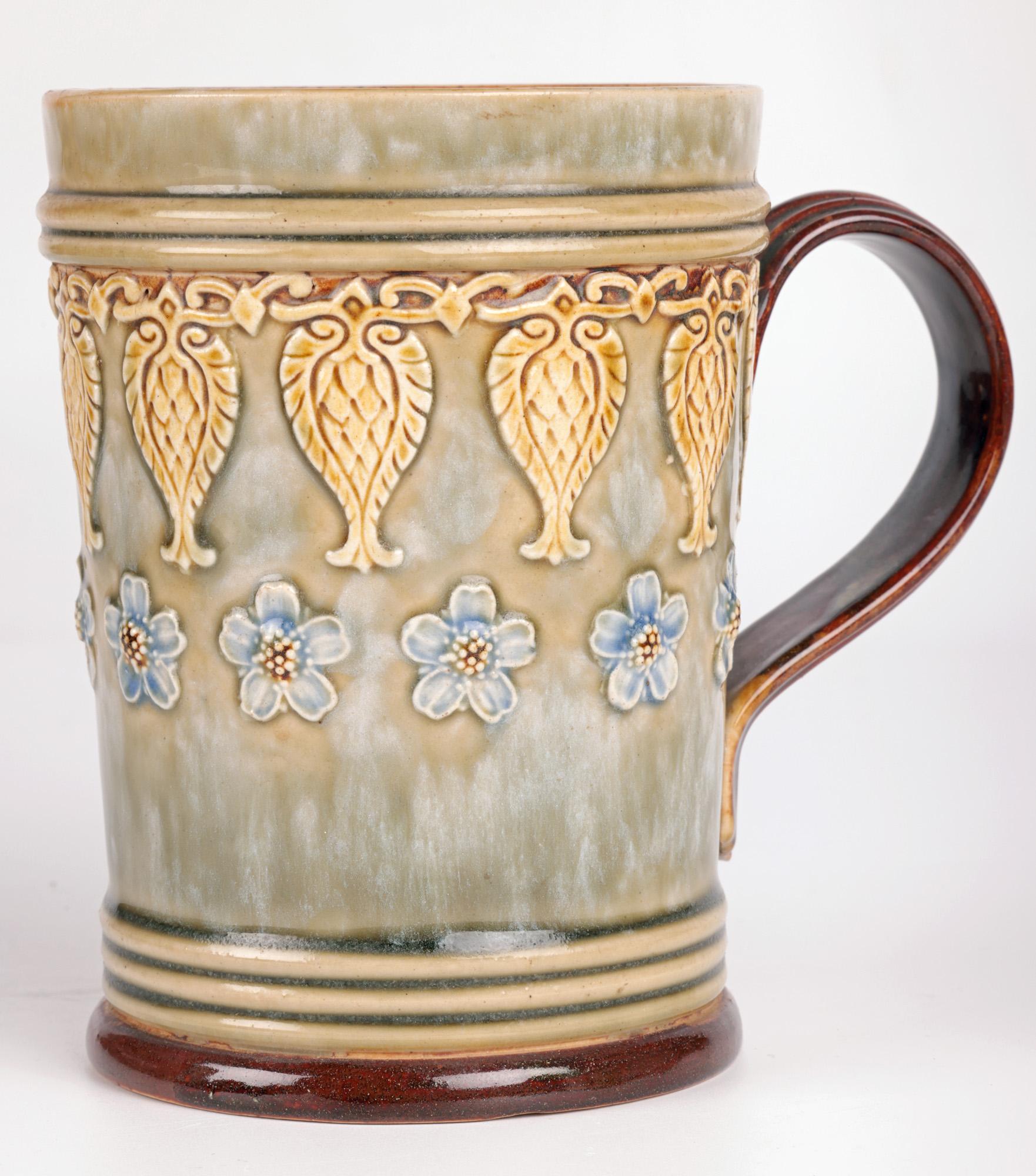 A very stylish pair Art Nouveau Doulton Lambeth floral design mugs by renowned artist Eleanor Tosen and dating from around 1905. We believe that these are original designs by Eleanor Tosen bearing her personal monogram mark. The stoneware mugs are