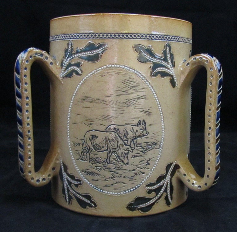 3538

Scarce Early Doulton Lambeth Tyg decorated with Pigs.

Small Invisible Restoration to rim chip 

Dated 1876

Dimensions
17cm high, 13cm wide

Complimentary Insured Postage
14 Day Money Back Guarantee
BADA Member – Buy the Best