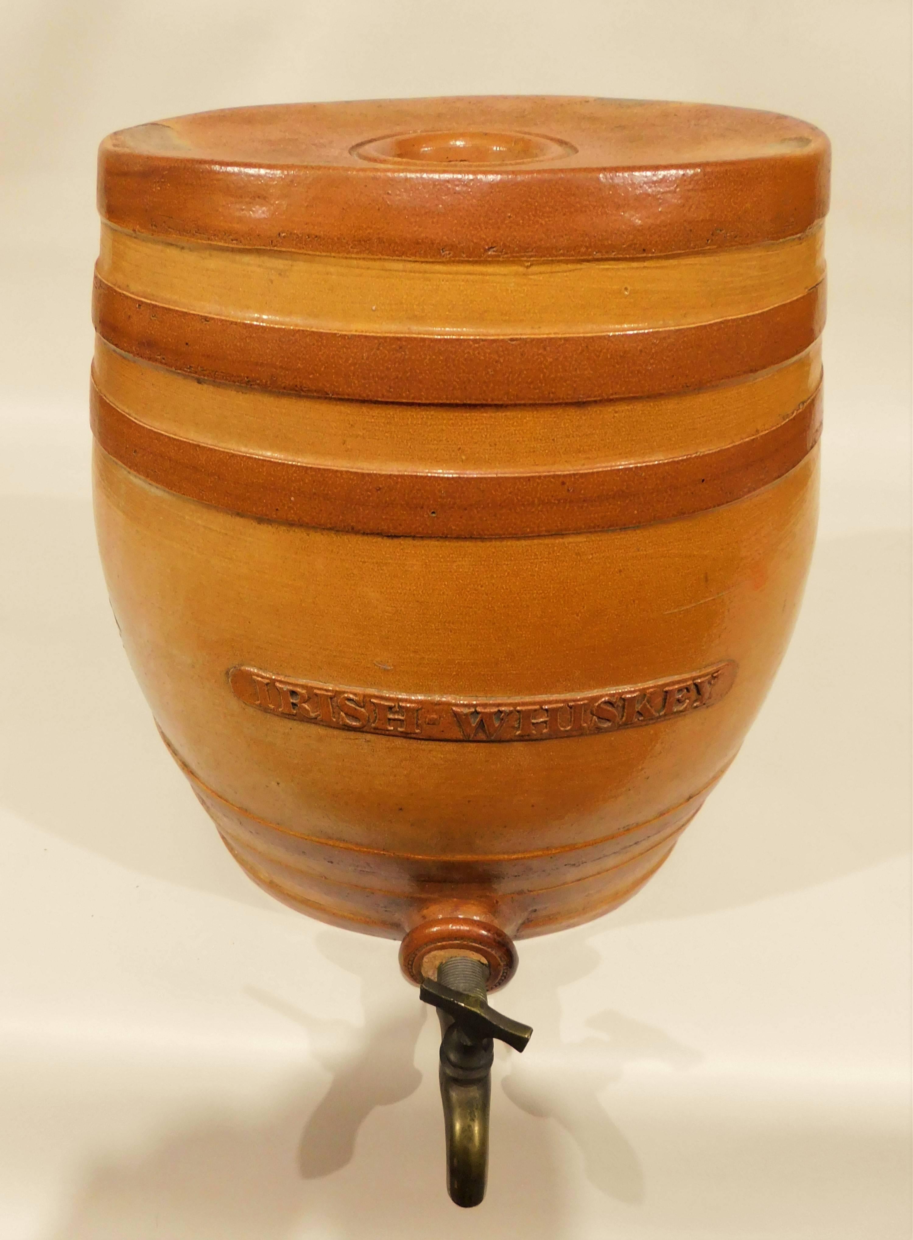 Large 19th century Doulton and Watts, Lambeth pottery, London antique stoneware keg barrel cask Irish whiskey bar liquor dispenser. Bottom has Doulton Lambeth stamped on it with the number two, spigot has Doulton Watts Lambeth pottery on it. Brass