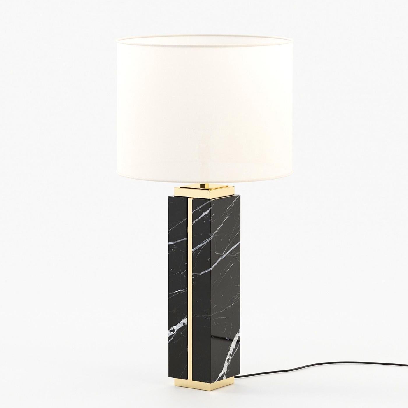 Table Lamp Dounia Marble with black marble and
polished stainless steel base in, stainless steel in 
gold finish, including a white lamp shade.
1 bulb, lamp holder type E27, max 40 watt, bulb not
included. Also available with other marble