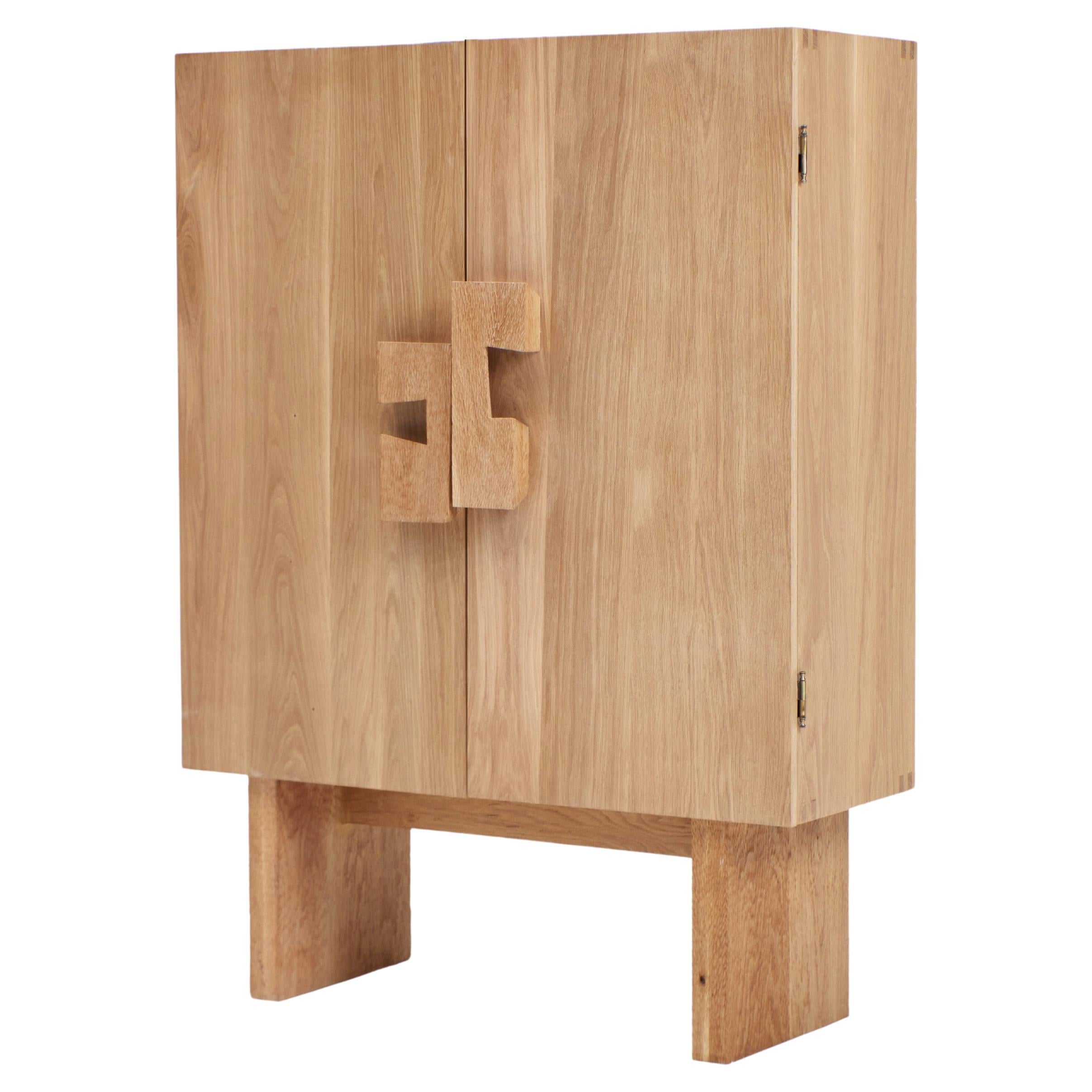 Douro Cabinet
Designed by Project 213A in 2023

Handmade by skilled artisans in solid oak. The cabinet features double doors with handles and legs decorated with a hand carved texture.

Bespoke dimensions and inner shelves upon request.
Production