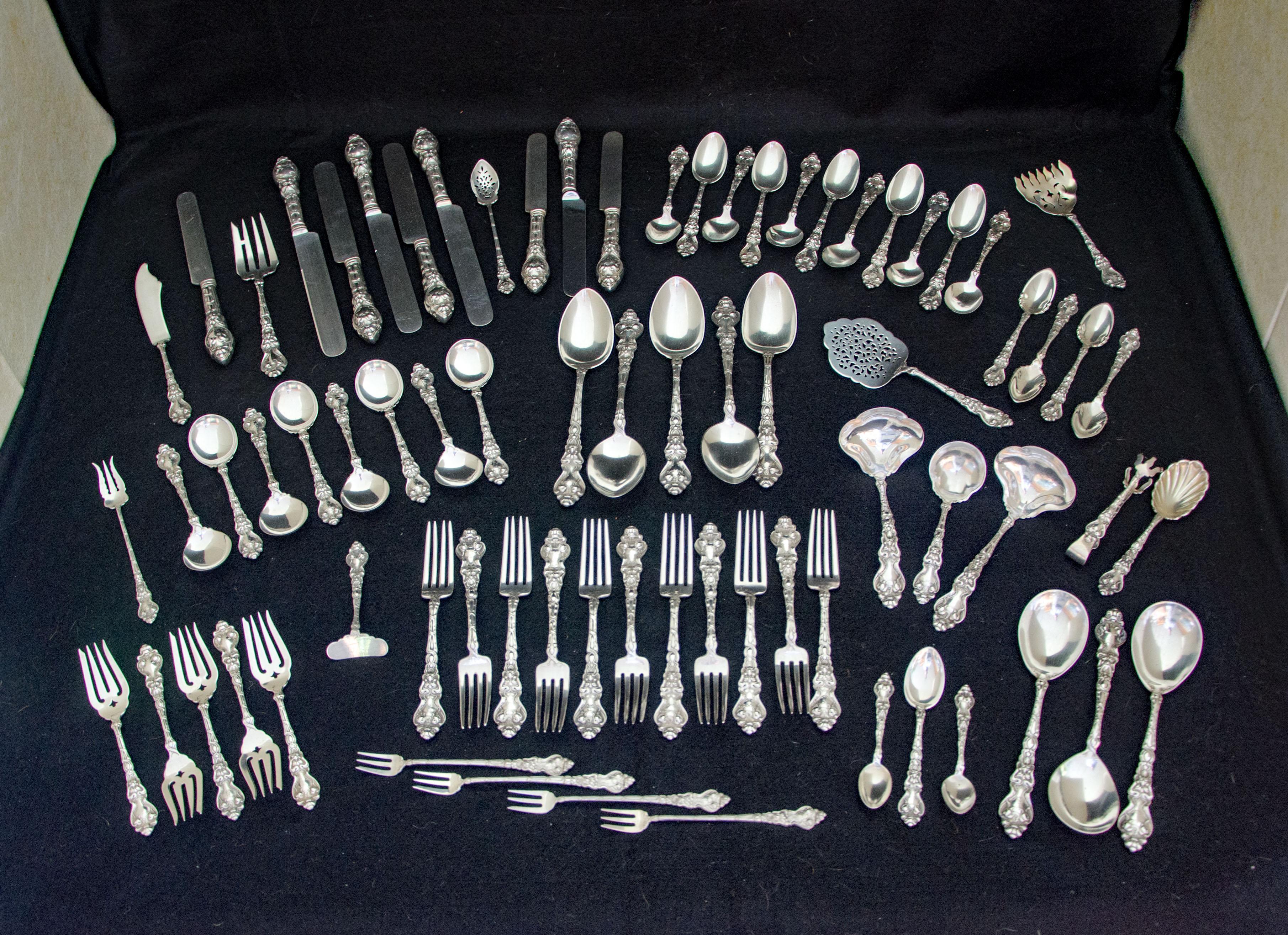 75 pieces Douvaine pattern Art Nouveau style flatware with quite a few serving pieces. This figural pattern features the north wind and a dolphin. Some items have monograms but they are hard to decipher. All pieces were polished but retain a nice