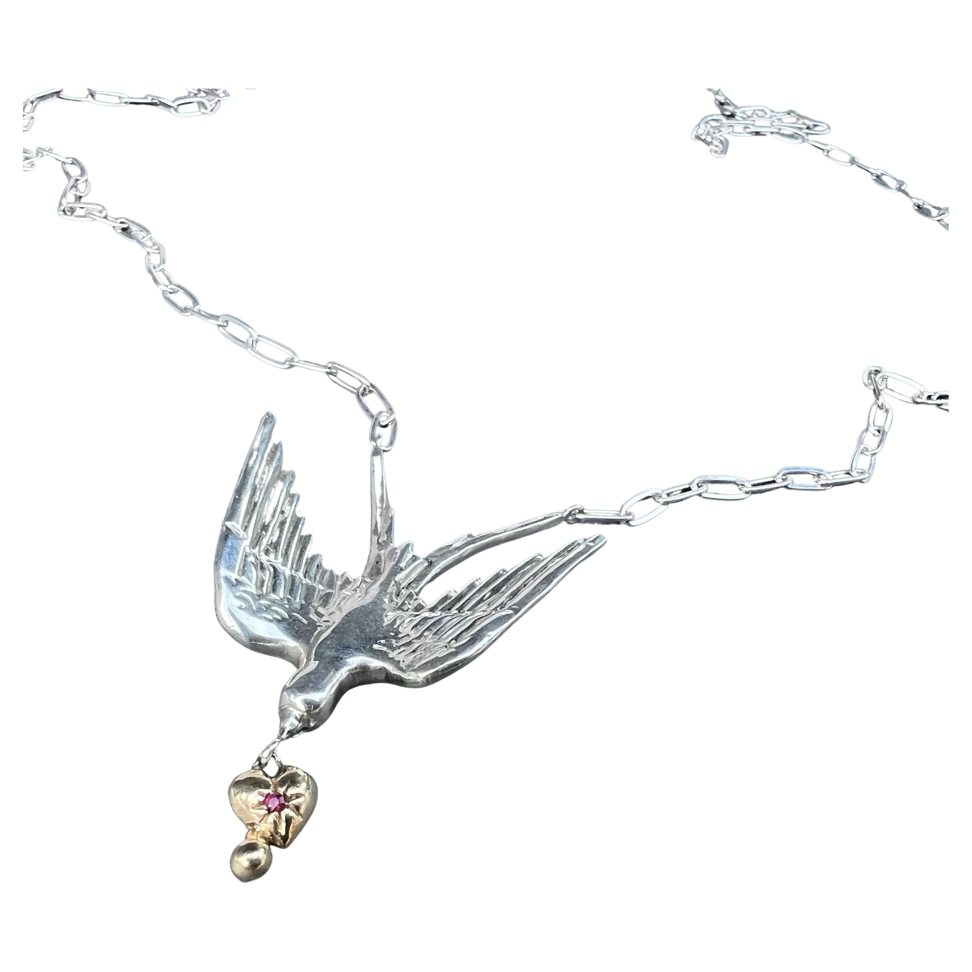 Animal jewelry Gold Heart Dove Necklace Silver Chain Ruby Victorian Style J Dauphin

The dove and heart are symbolizing Love, hope and promise together but the dove also represents peace of the deepest kind. It soothes and quiets our worried or