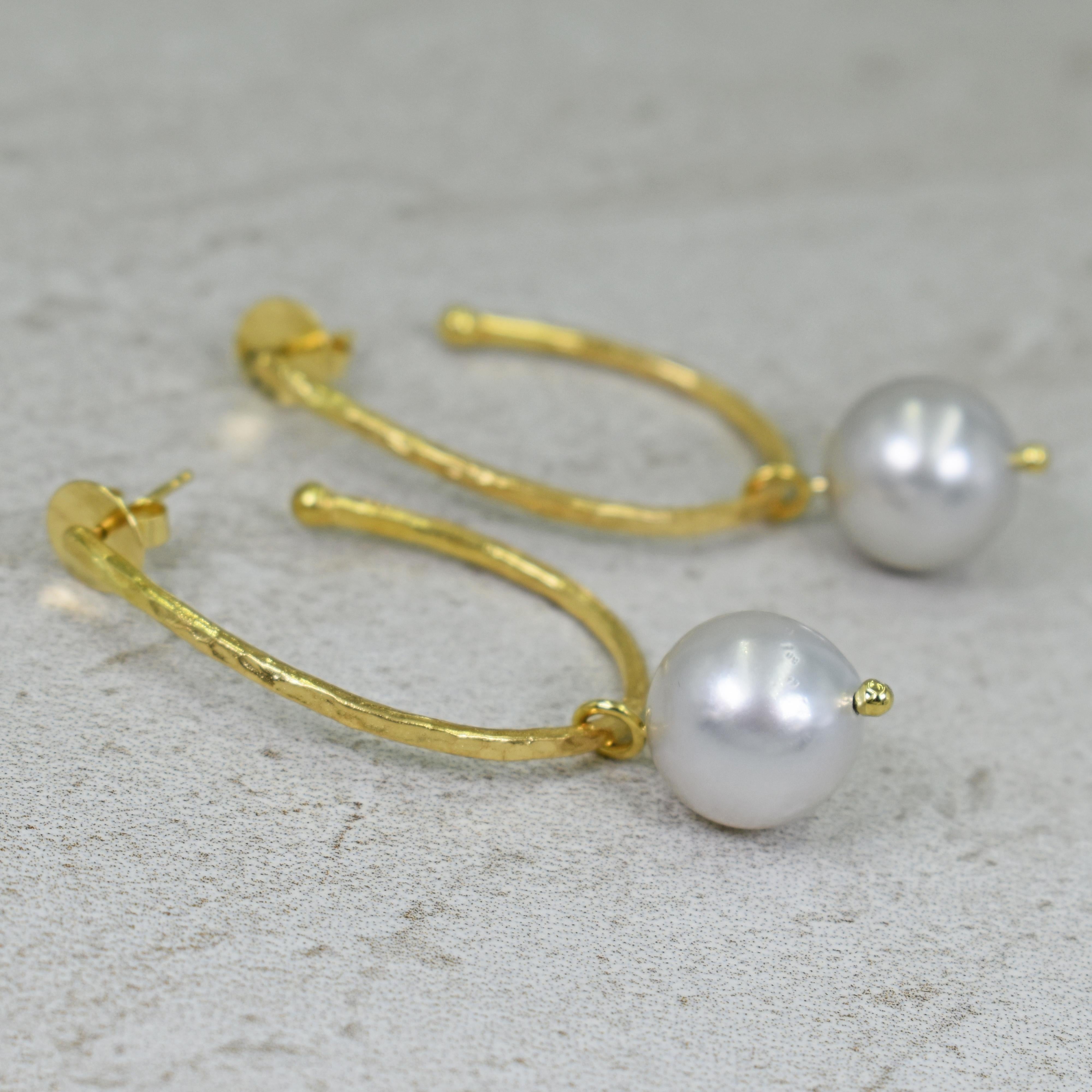 Hammered 18k yellow gold elongated hoop stud earrings with 14.5mm Dove Gray Freshwater Pearl charms. Hoop earrings are 1.63 inches in length, and with pearl charms, earrings are 2.38 inches in total length. Charms can be removed so the hoops can be