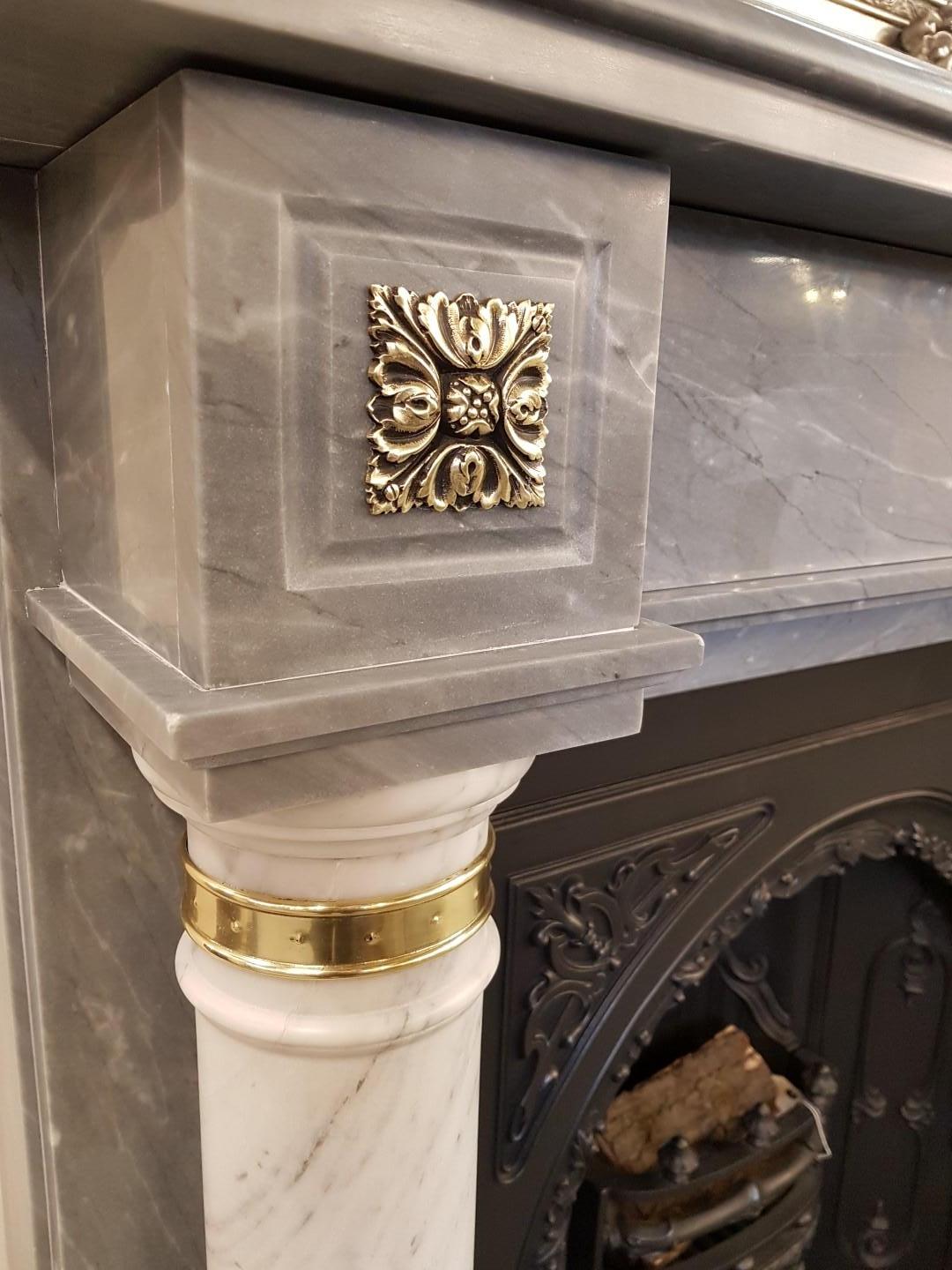 Stunning dove grey marble mantel with Carrara marble columns and brass embellishments.

Fully restored and polished, ready to use.

Insert shown is available separately but not included in the price.

Mantel shelf: 58”

Mantel height: