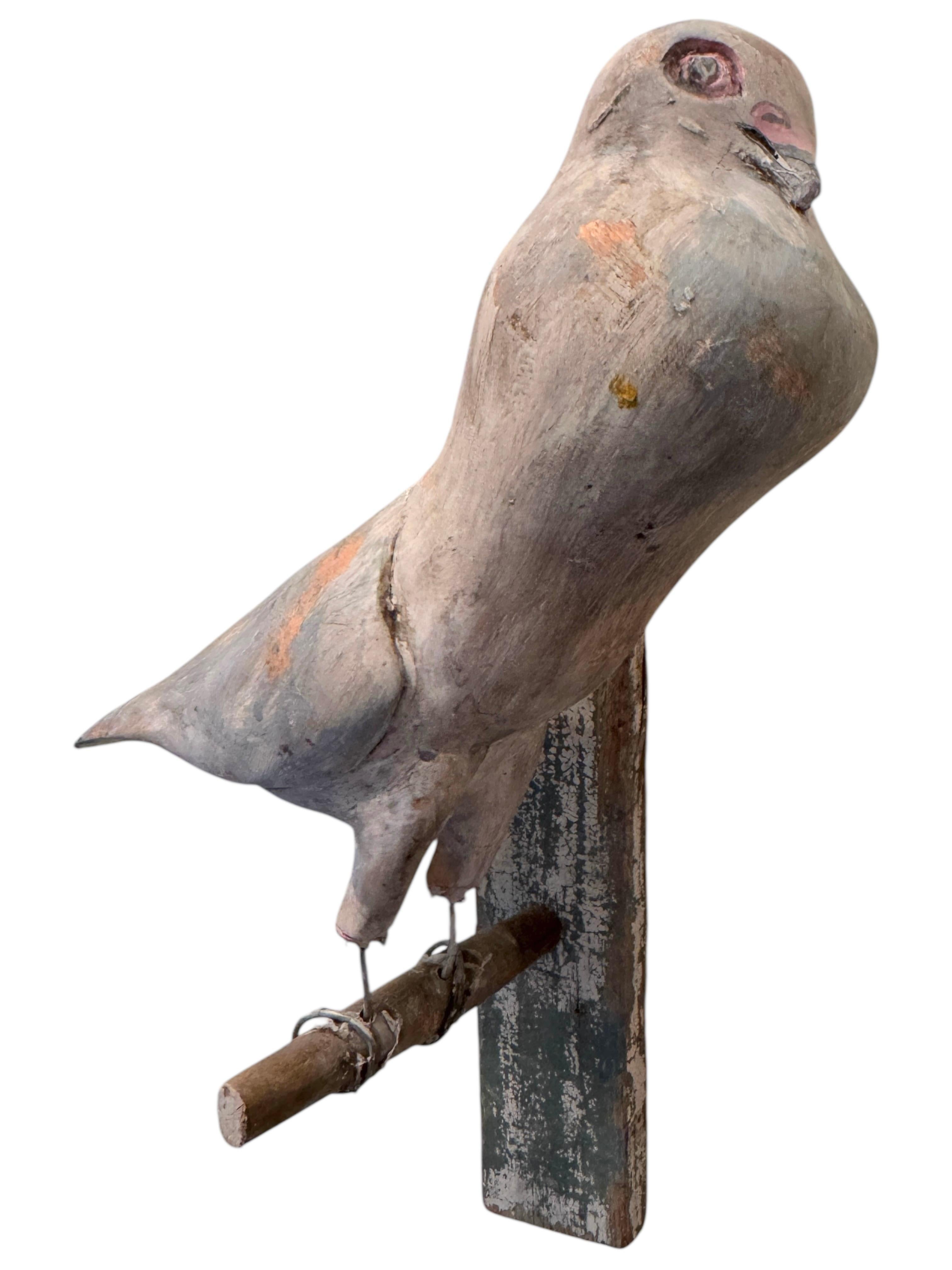 A beautiful Austrian 20th century, carved wood bird, mounted on a stand for hanging. The tradition of these in Austria called 