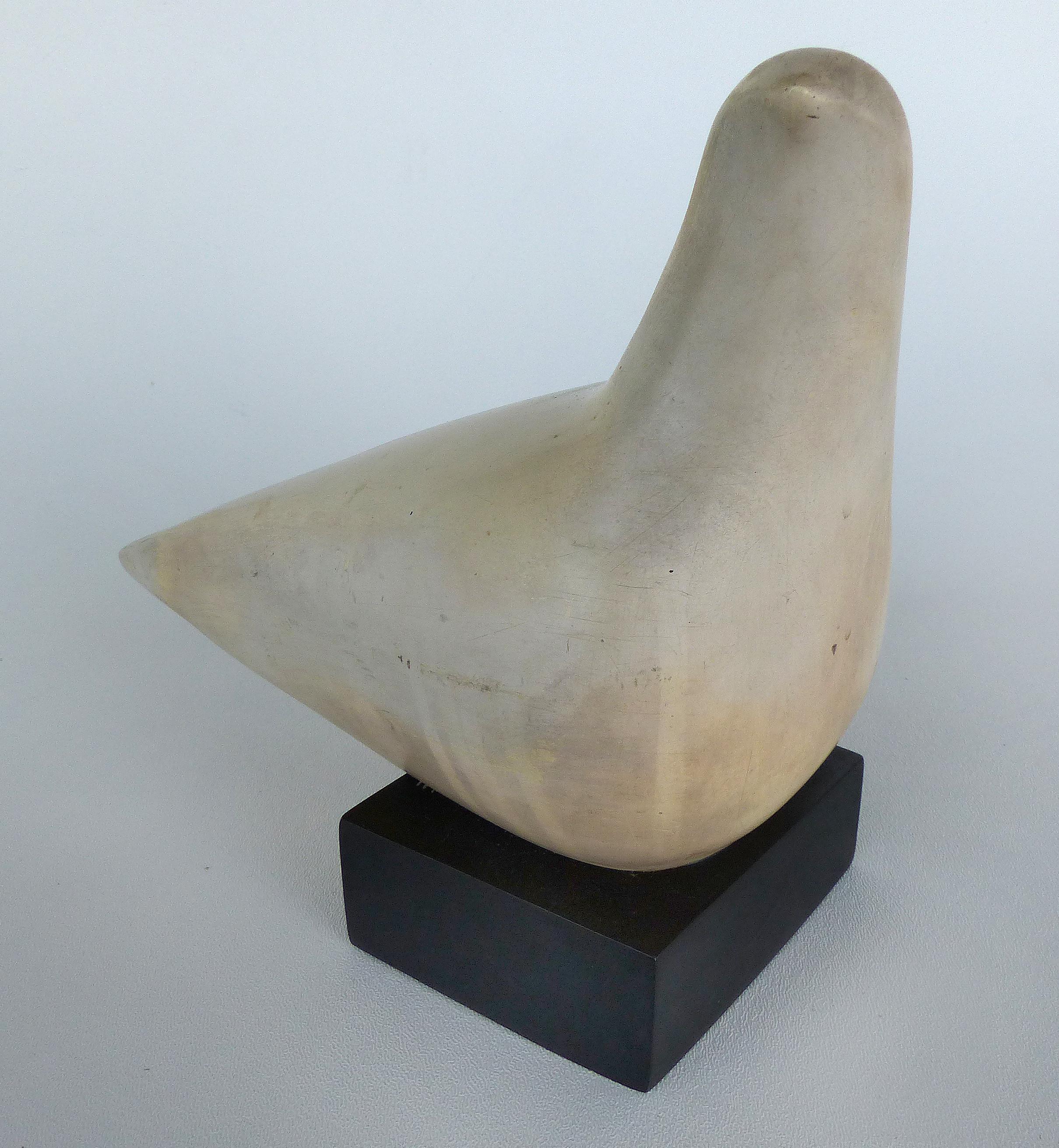 Cleo Hartwig dove sculpture

Offered for sale is a Mid-Century Modern sculpture of a resin dove on a square base by American artist Cleo Hartwig. This piece is signed on the underside of the tail. Hartwig belongs to a line of direct carvers which