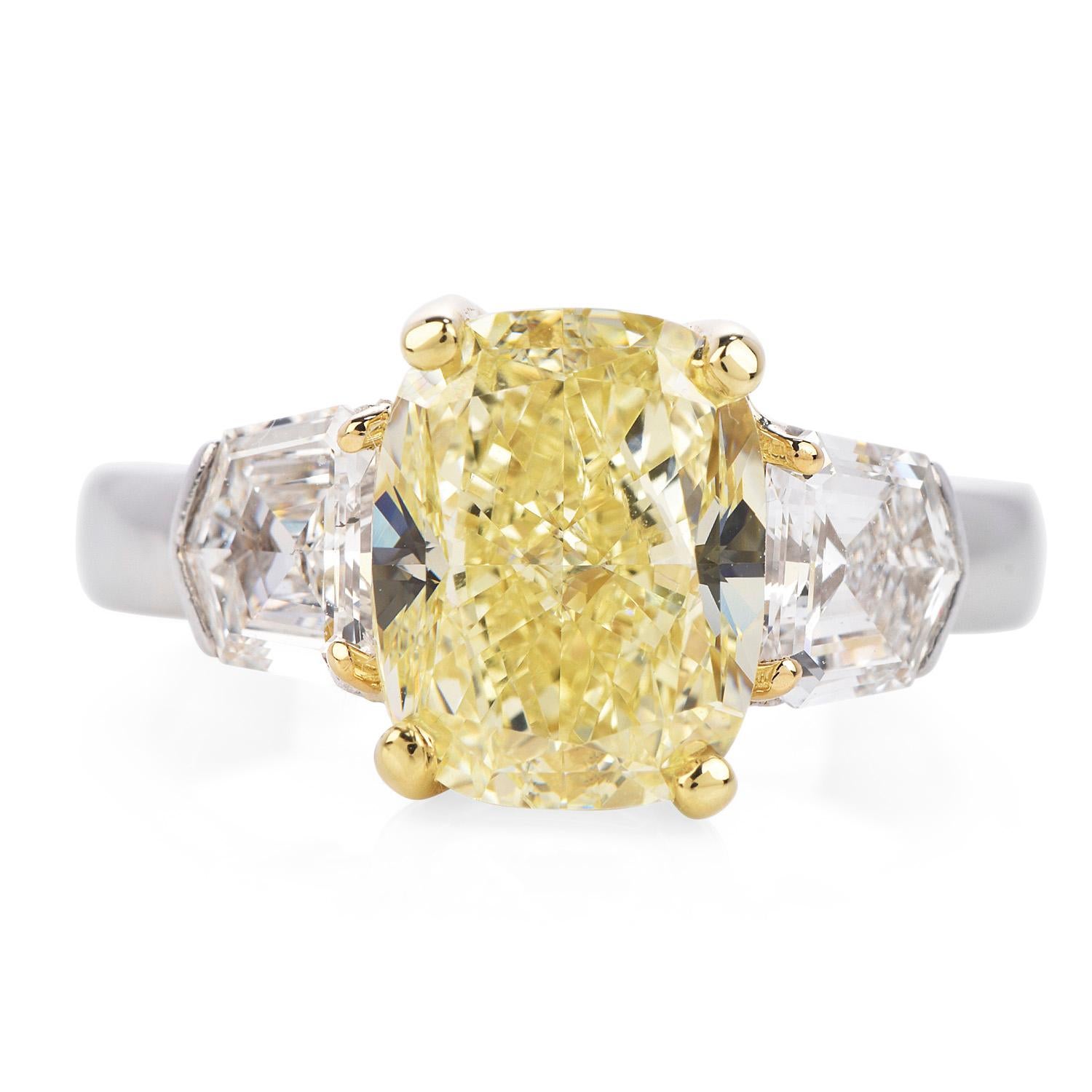 Classic Three Stone Style GIA Certified Fancy Light Yellow Diamond Engagement Ring Dazzles us with its natural sparkle.

Exquisitely crafted in solid platinum, with an approximate total weight of 7.90 grams,

featuring1 GIA natural genuine diamond