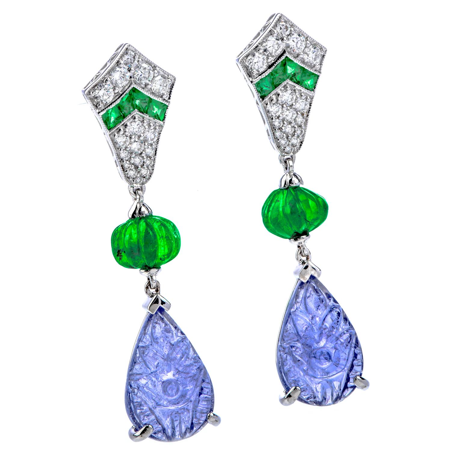 Feel unique and ethereal in with these Estate Diamond Emerald Tanzanite Carved Drop Dangle Earrings! These earrings are carefully crafted in 18 karat white gold with post backings for pierced ears.  There are two pear-shaped, carved genuine