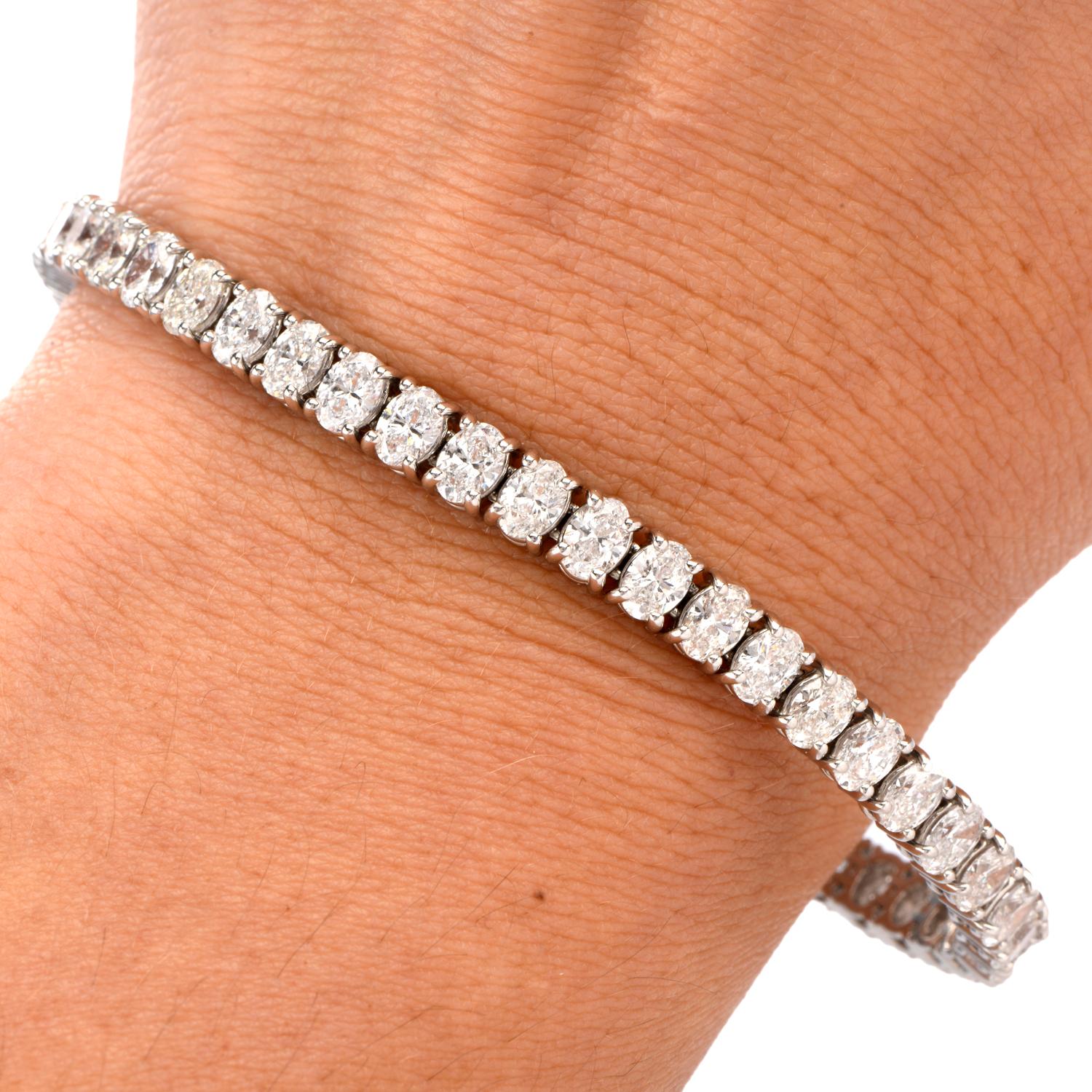 A diamond by any other name.....

This is no ordinary bracelet as it features 49 oval cut faceted Diamonds

running from end to end.

Diamonds weigh collectively appx. 9.43 carats.

Graded as G-H color and VS2-SI1 clarity.

Secured with a hidden