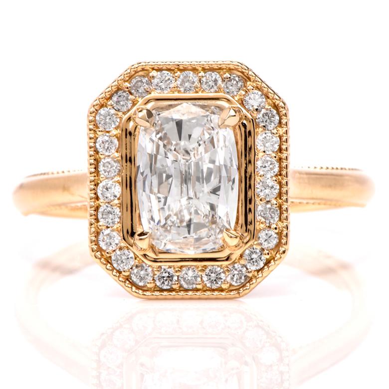 This stunning diamond engagement ring is crafted in 18K yellow gold. Displaying a prominent four prong set cushion cut GIA certified diamond approx. 1.04 CT, D color, SI1 clarity. Surrounded by a halo and filigree design gallery of 52 small