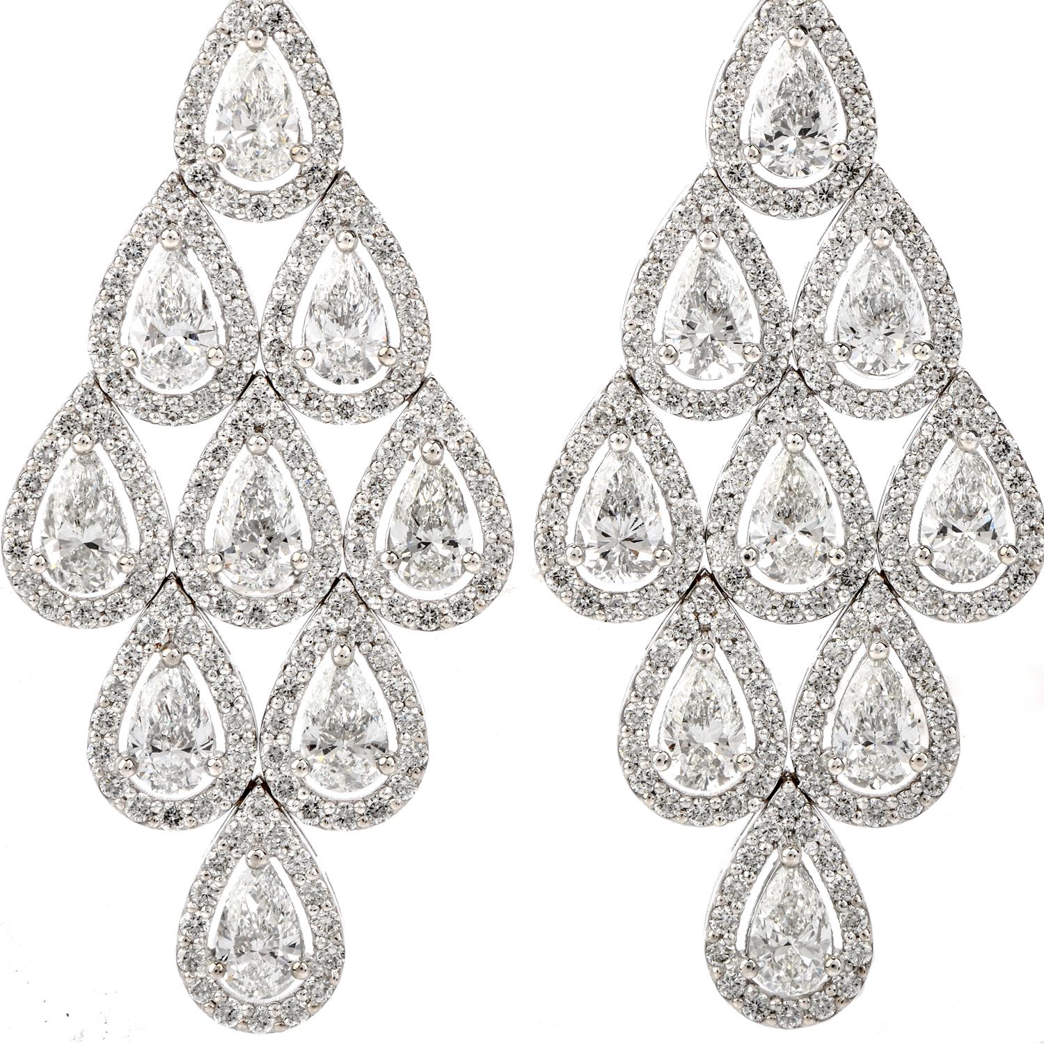 Sparkle elegantly across the room with these breathtaking Estate Diamond 18K Gold Pear Halo Drop Chandelier Earrings.

  These fancy earrings are crafted in 18 karat weight gold.  They hold approximately 20 genuine pear shaped diamonds, prong set of