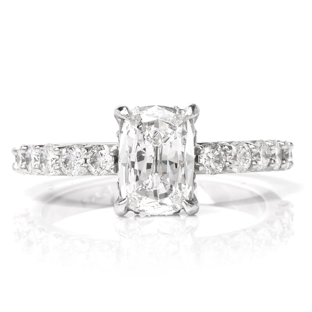 This stunning diamond engagement ring is crafted in solid platinum. Displaying a four-prong set cushion brilliant GIA certified diamond approx. 1.02ct, D color, VS1 clarity. Embellished by pave set shank of round cut diamonds collectively weighing