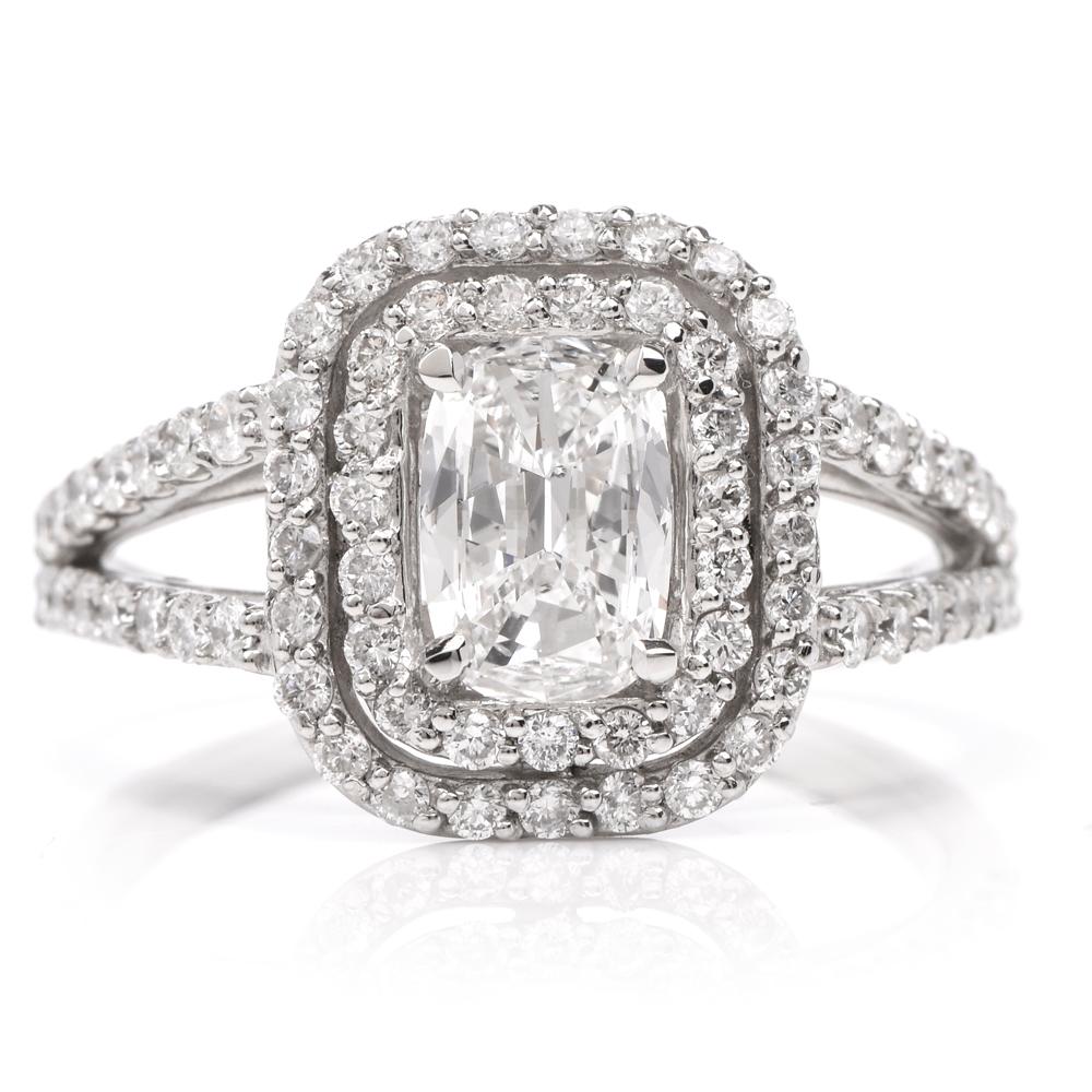 This stunning diamond engagement ring is crafted in solid platinum. Displaying a prominent four prong set cushion brilliant GIA certified diamond approx. 0.80 CT, E color, SI2 clarity. Surrounded by a double halo and split shank of pave set small